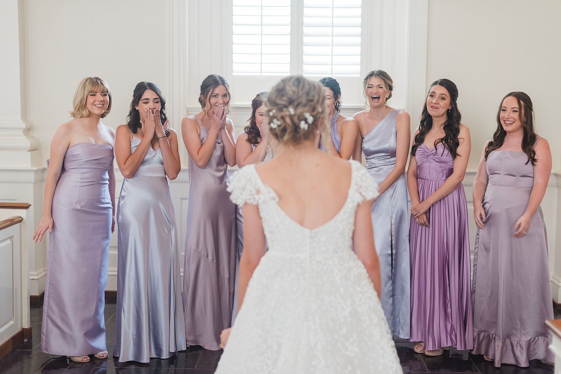 bride's first look with bridesmaids