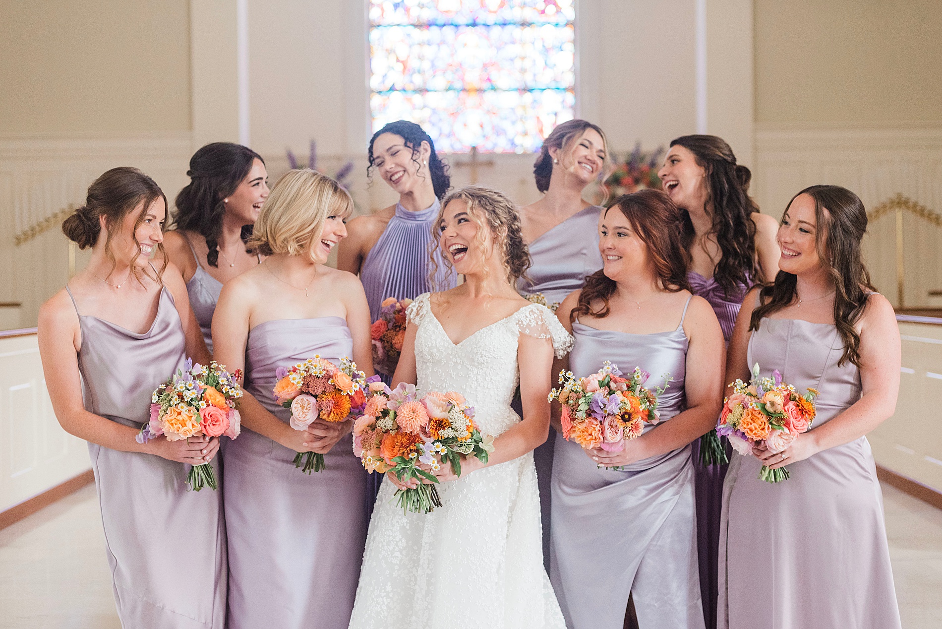 bridesmaids in lavender dresses with bride 