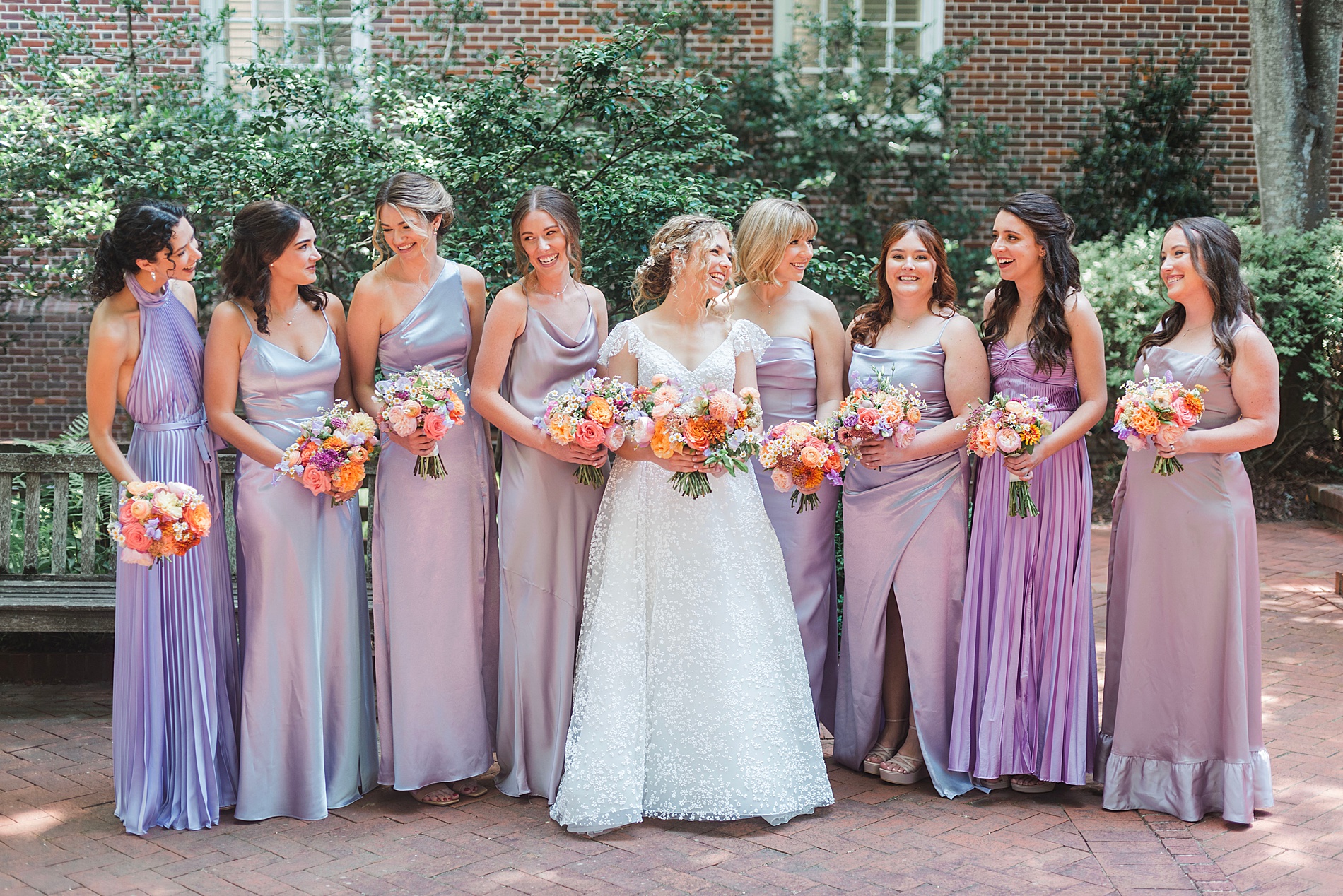 bride with bridesmaids in lavender dresses 