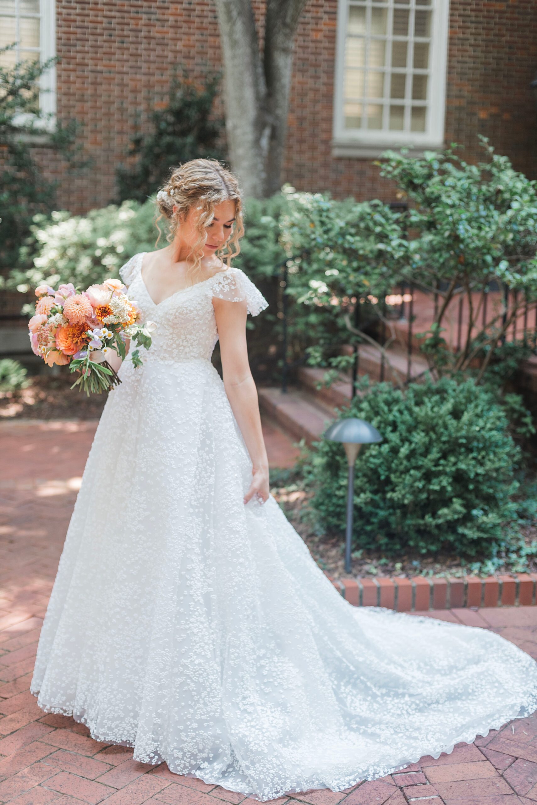 bride holds colorful bouquet  