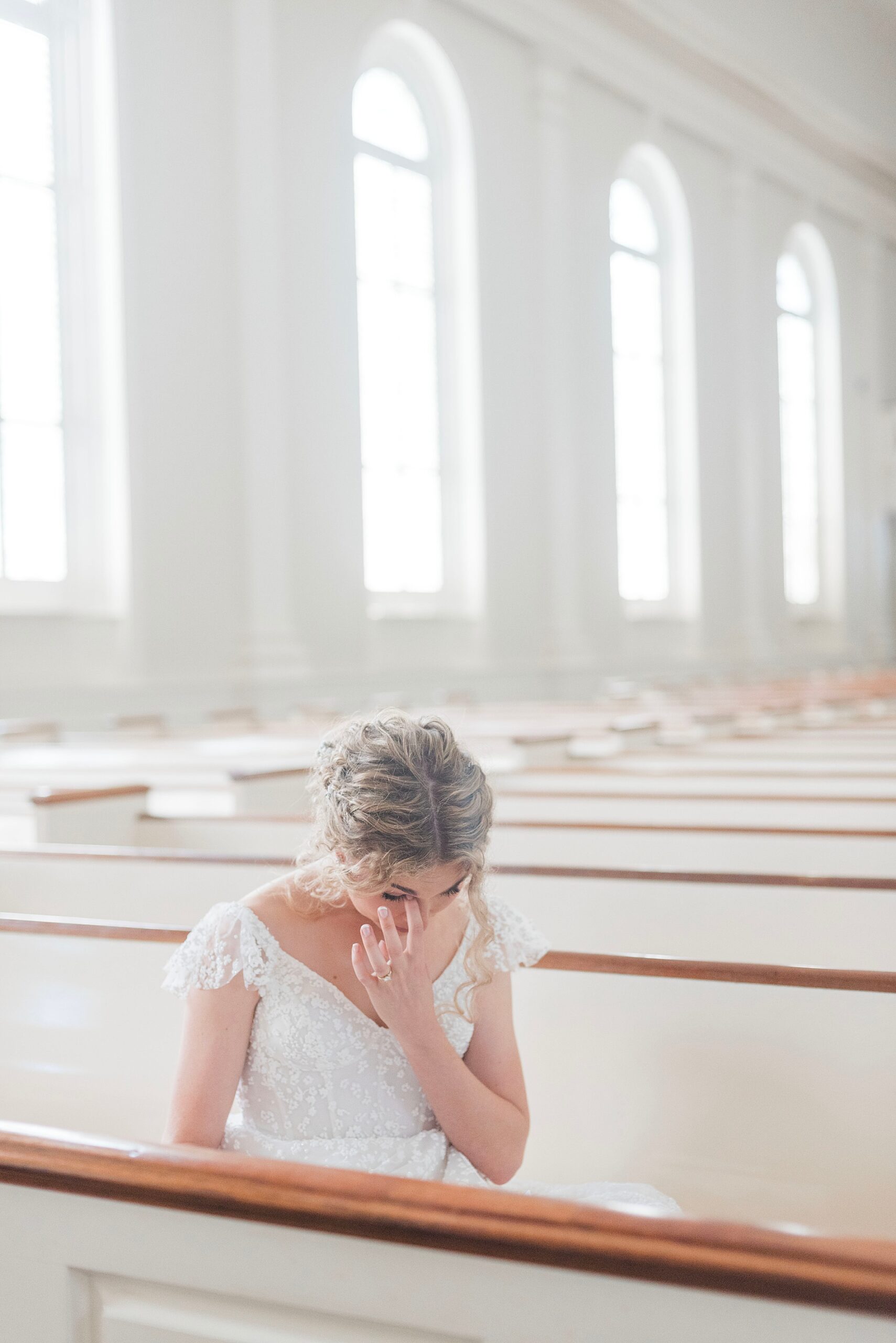 bride wipes away tears reading letter