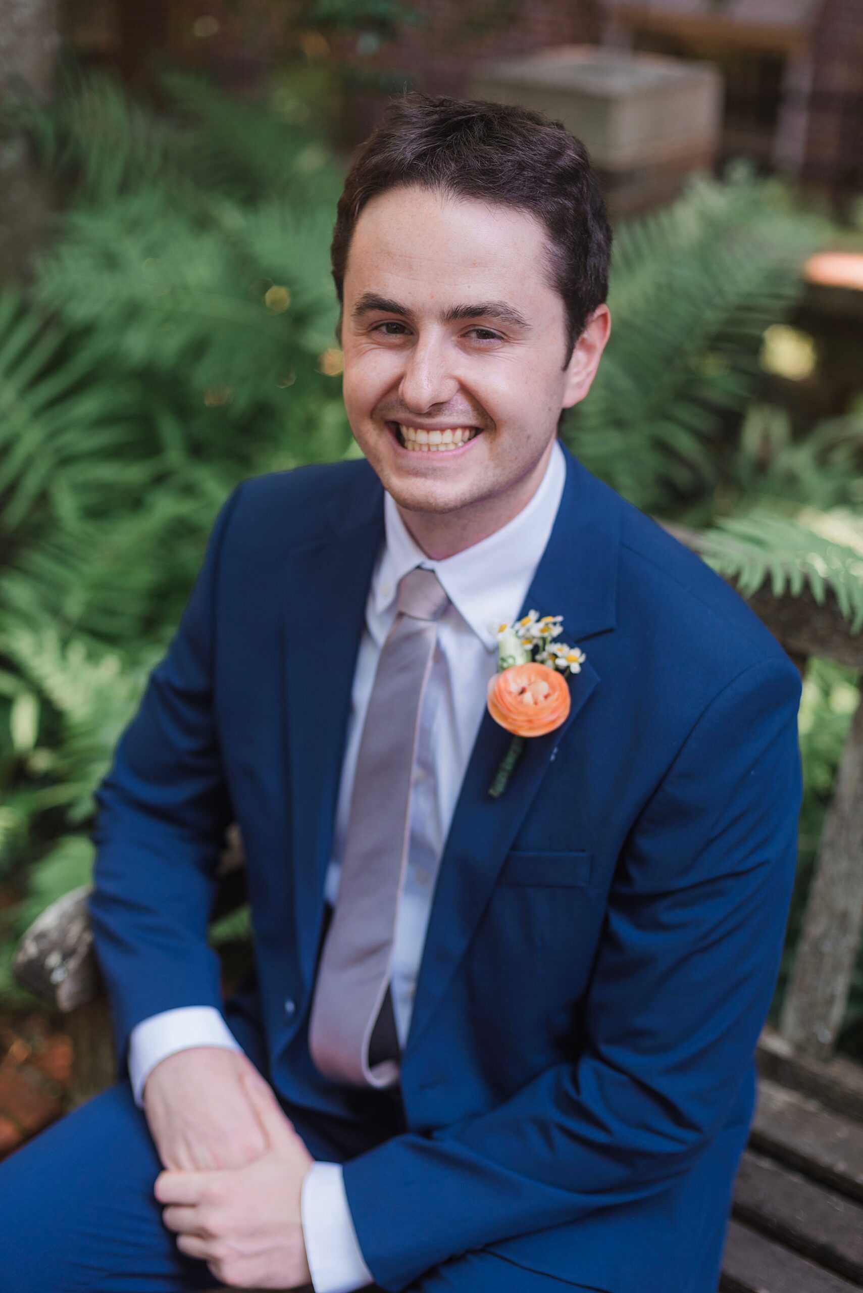 groom sits on bench