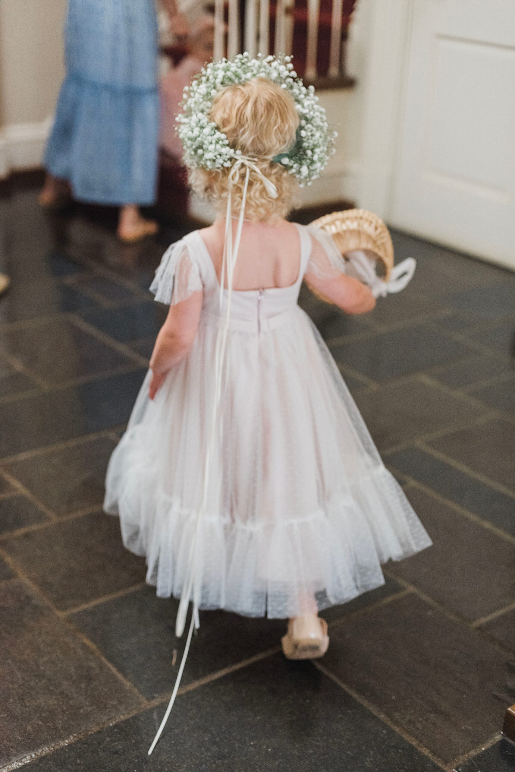 flower girl getting ready to walk down the aisle 