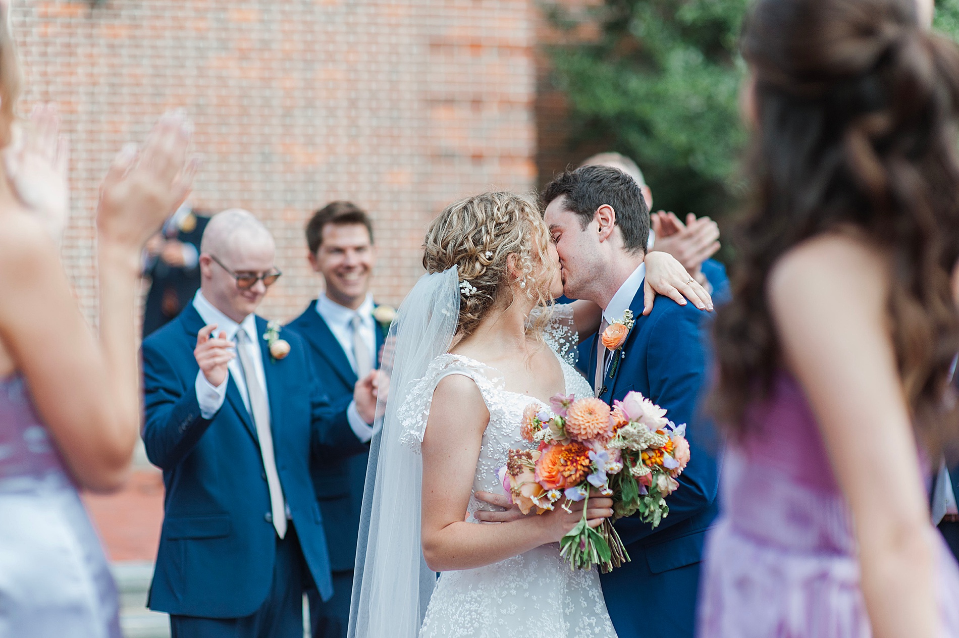 newlyweds kiss outside of church