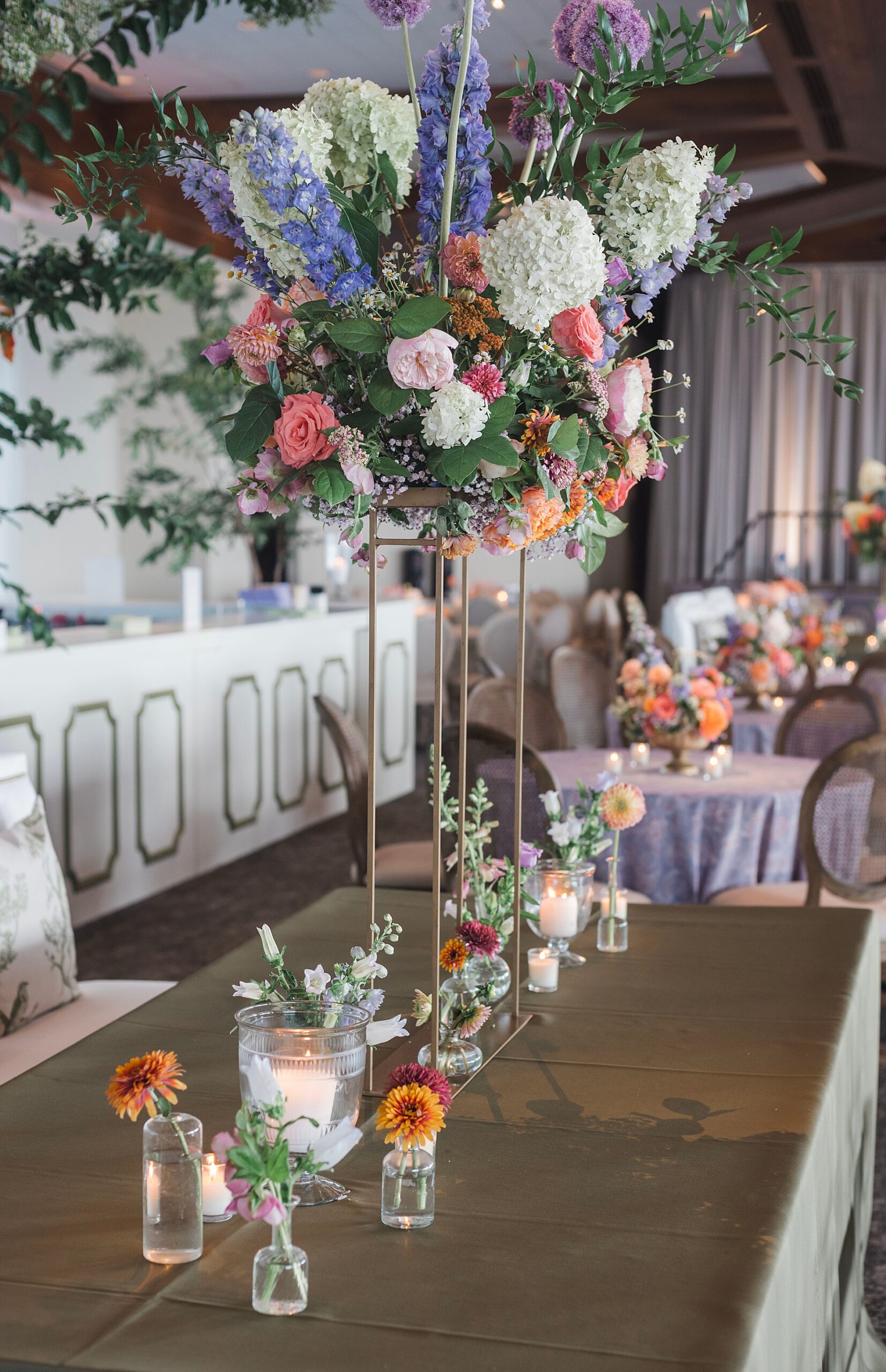 floral centerpieces in tall clear vases