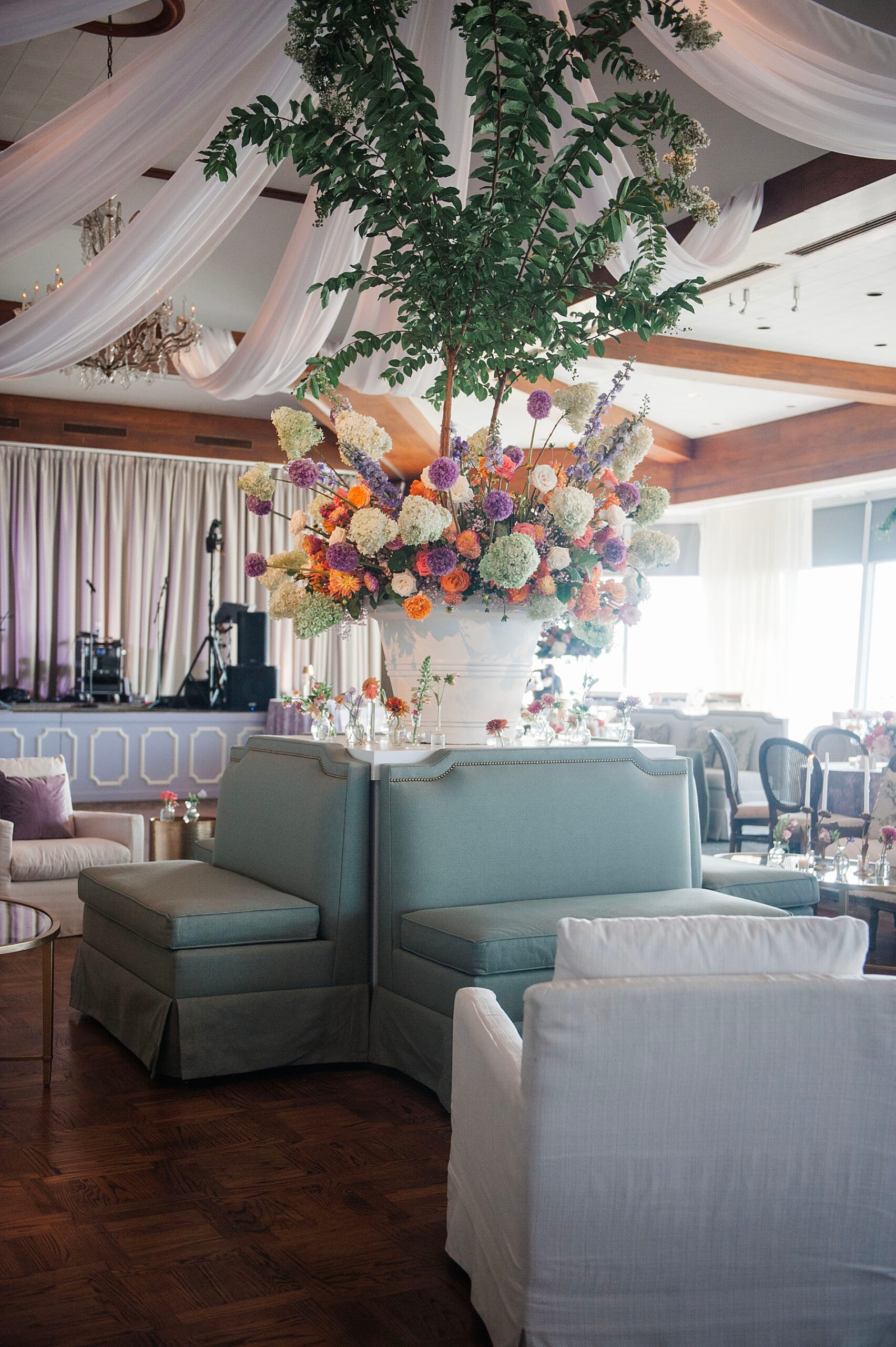 beautiful floral arrangements decorate wedding reception at The Club 