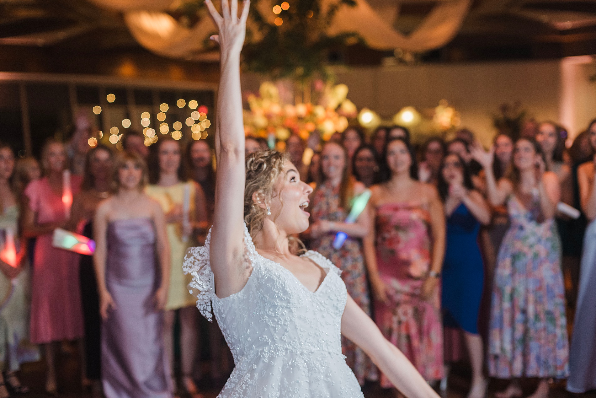 bride throws bouquet at Enchanting Dream Wedding at The Club