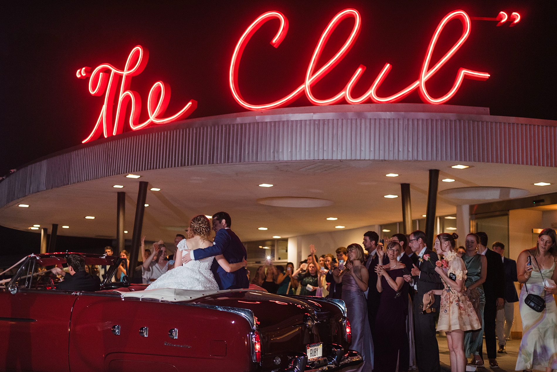 couple in getaway car as the leave their Enchanting Dream Wedding at The Club