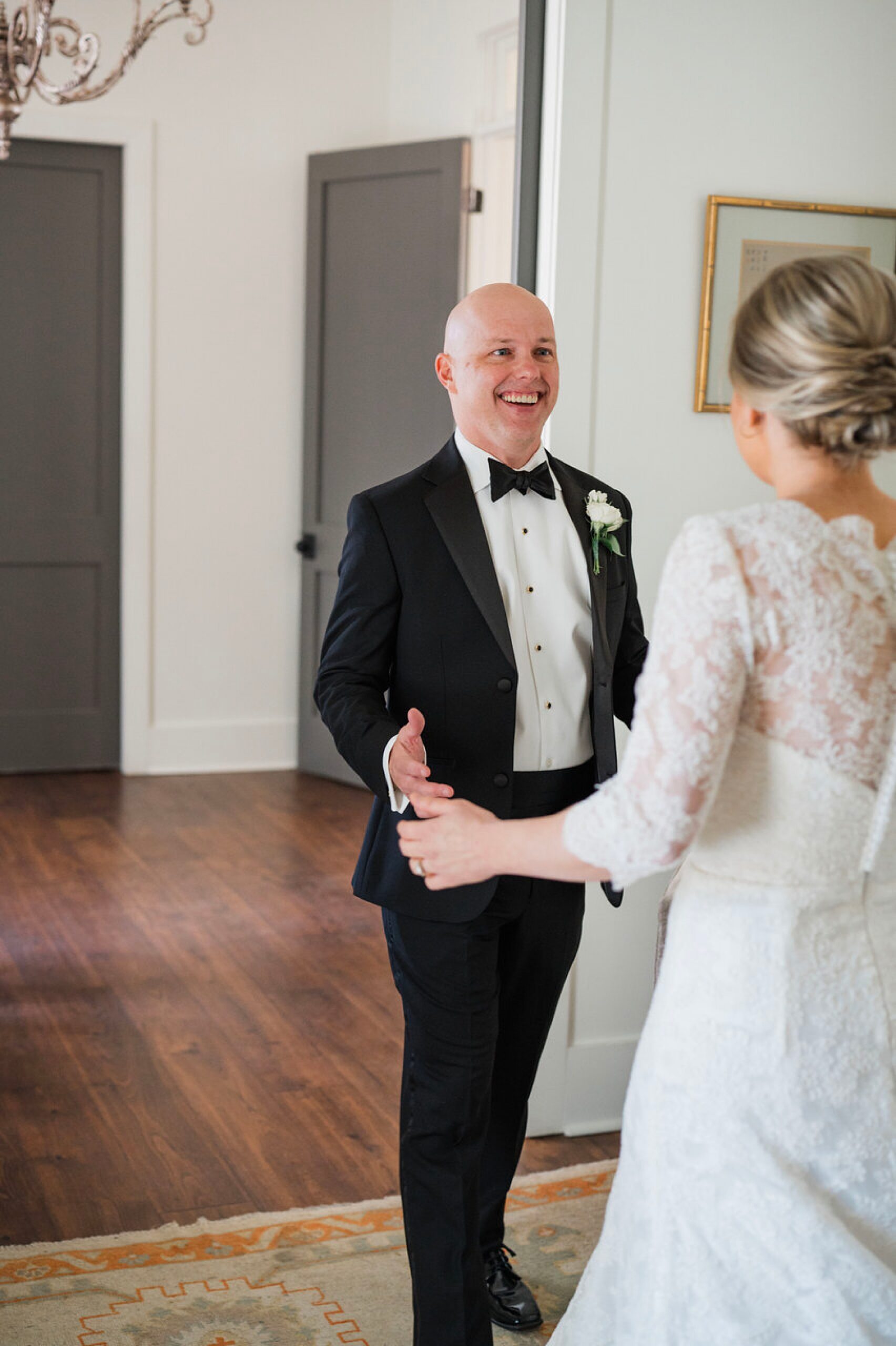 joyful groom sees bride for the first time