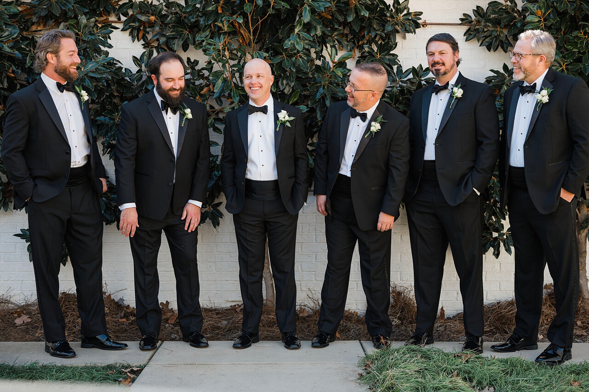 groom and groomsmen in tuxes