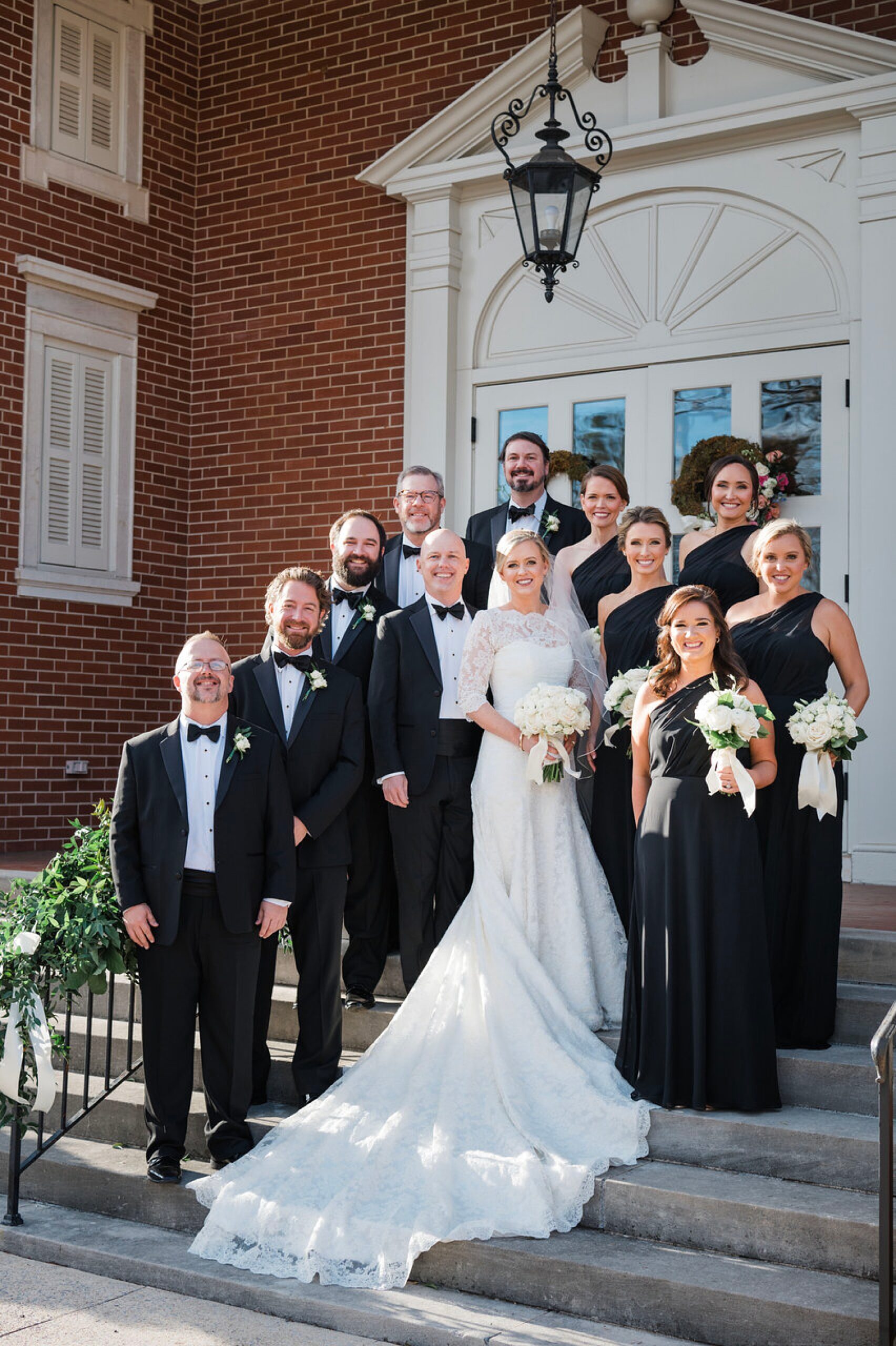 wedding party on steps of church before Joyful Witt House Wedding 