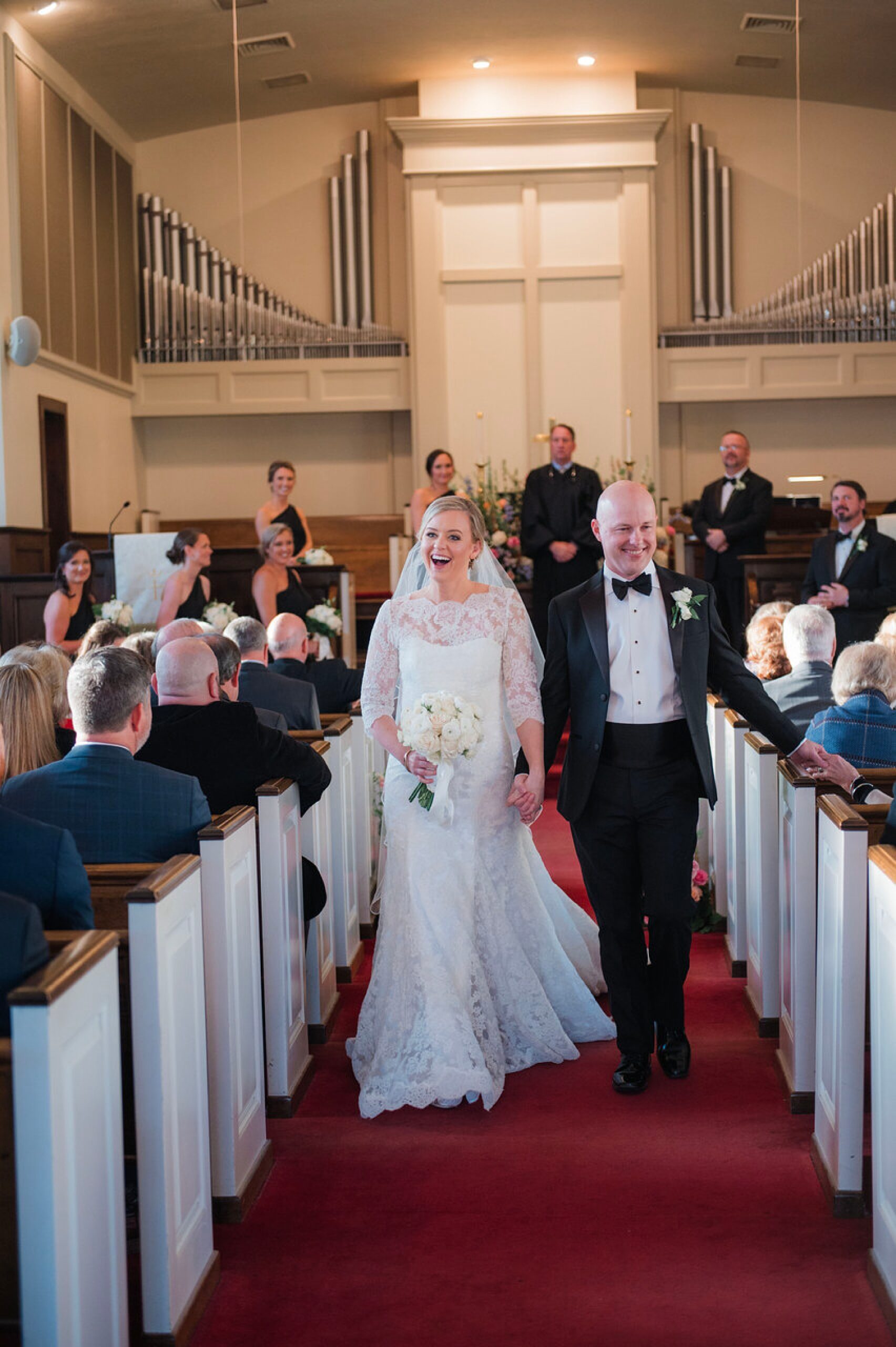 newlyweds exit wedding ceremony 