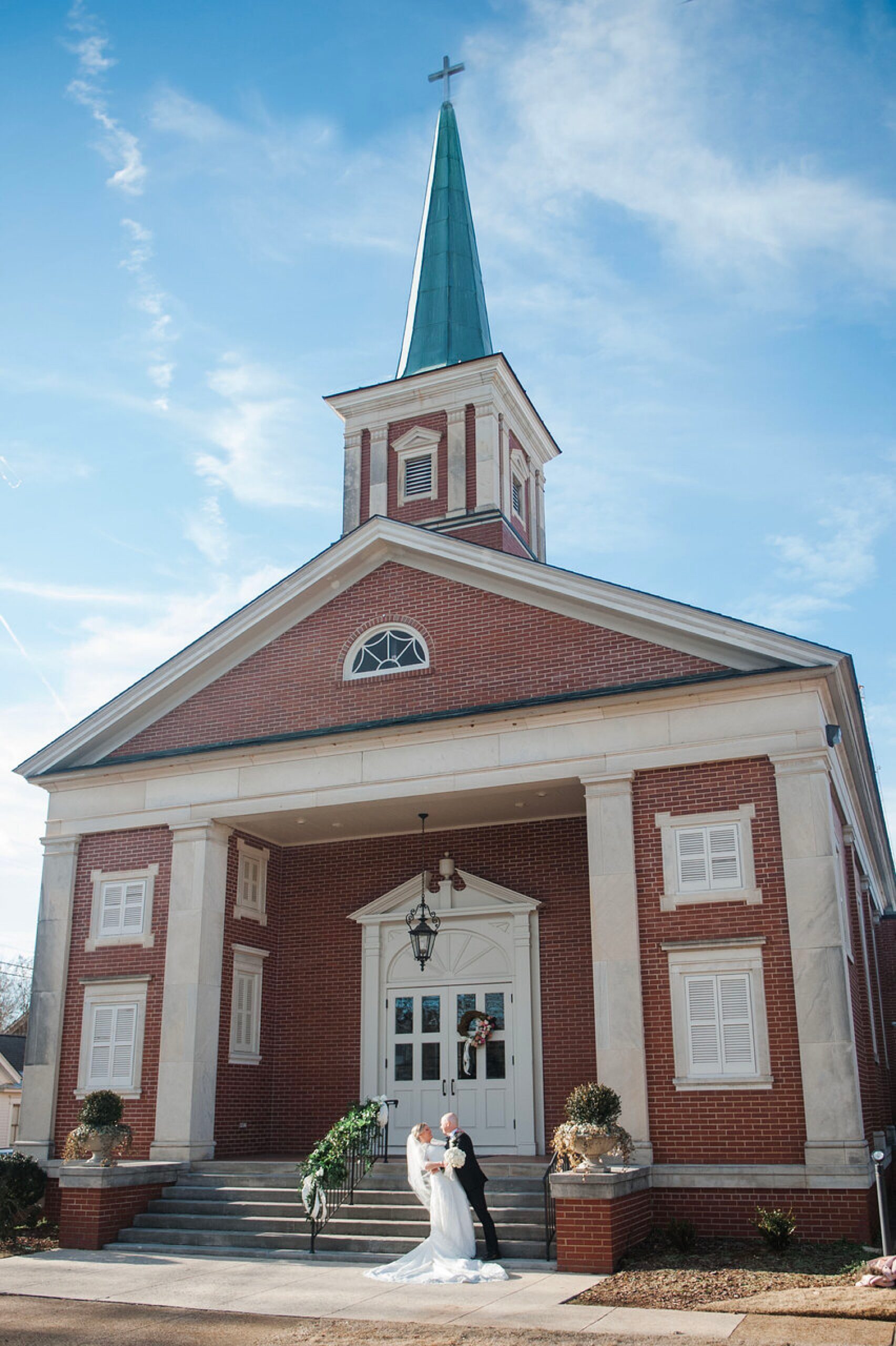 timeless newlywed photos outside of church 