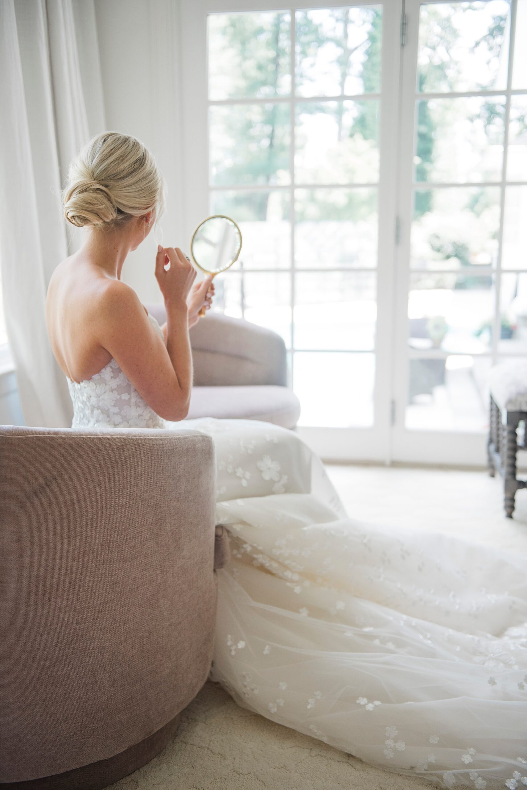 Bride looking in mirror
