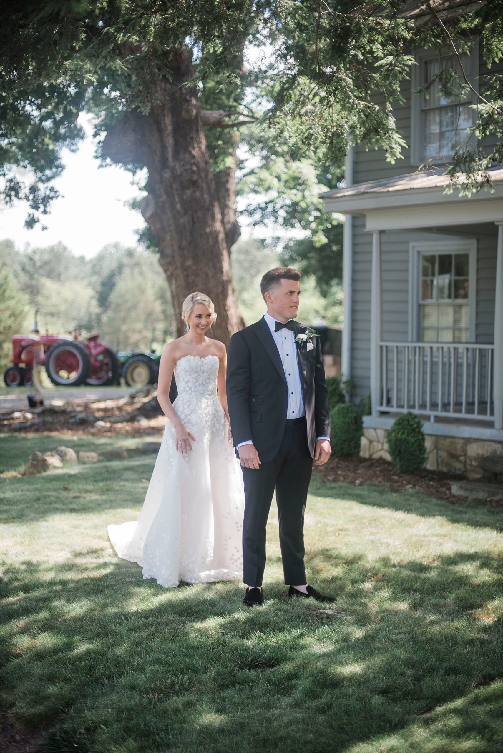 bride walks up behind groom for first look