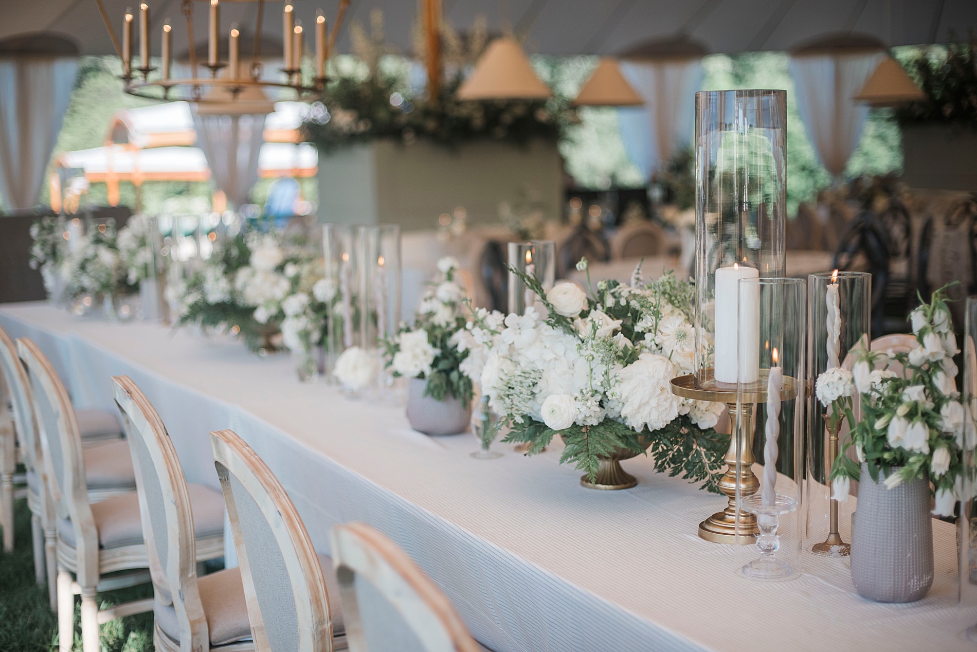 Elegant tablescapes with low white flower centerpieces