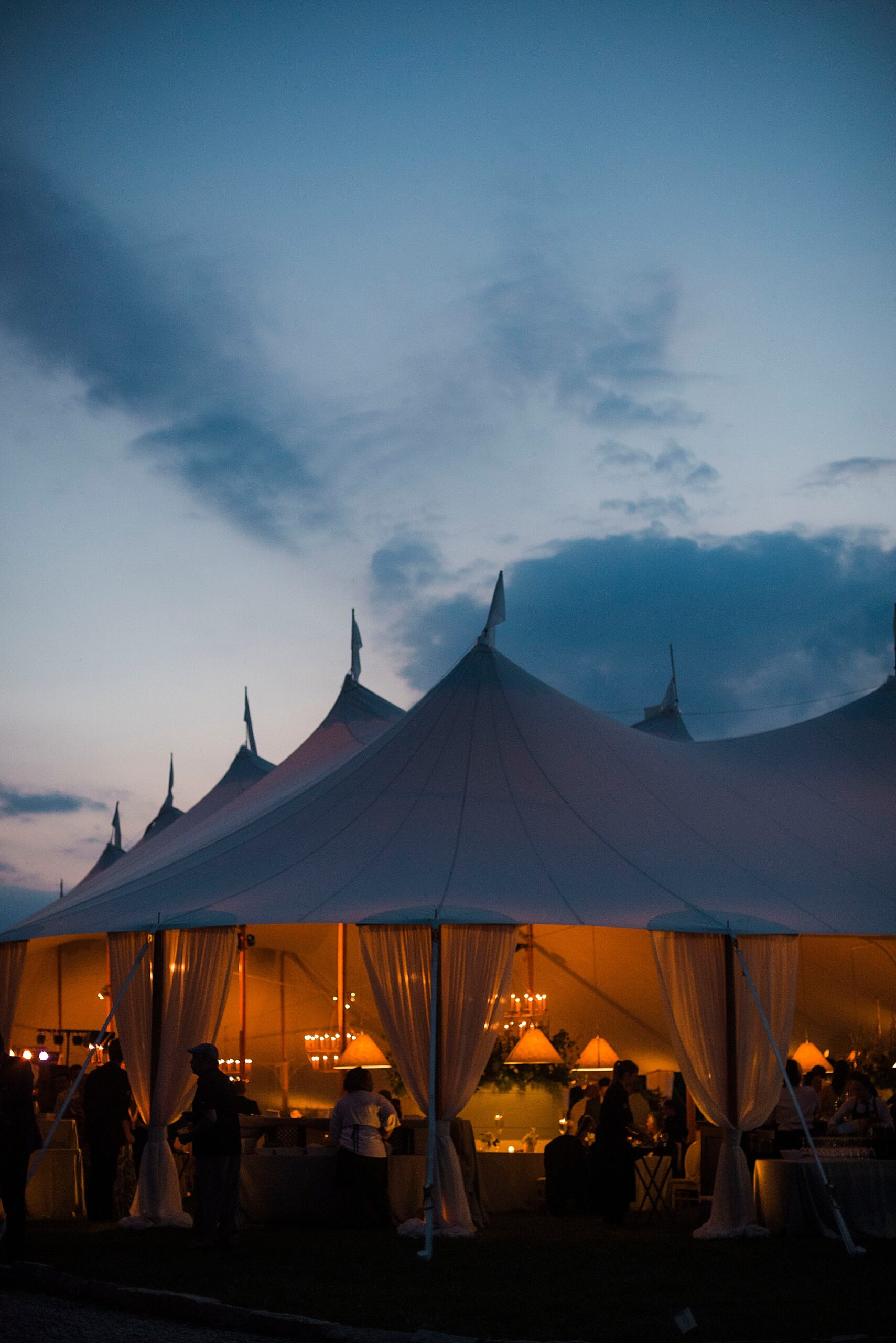 tented wedding reception at dusk