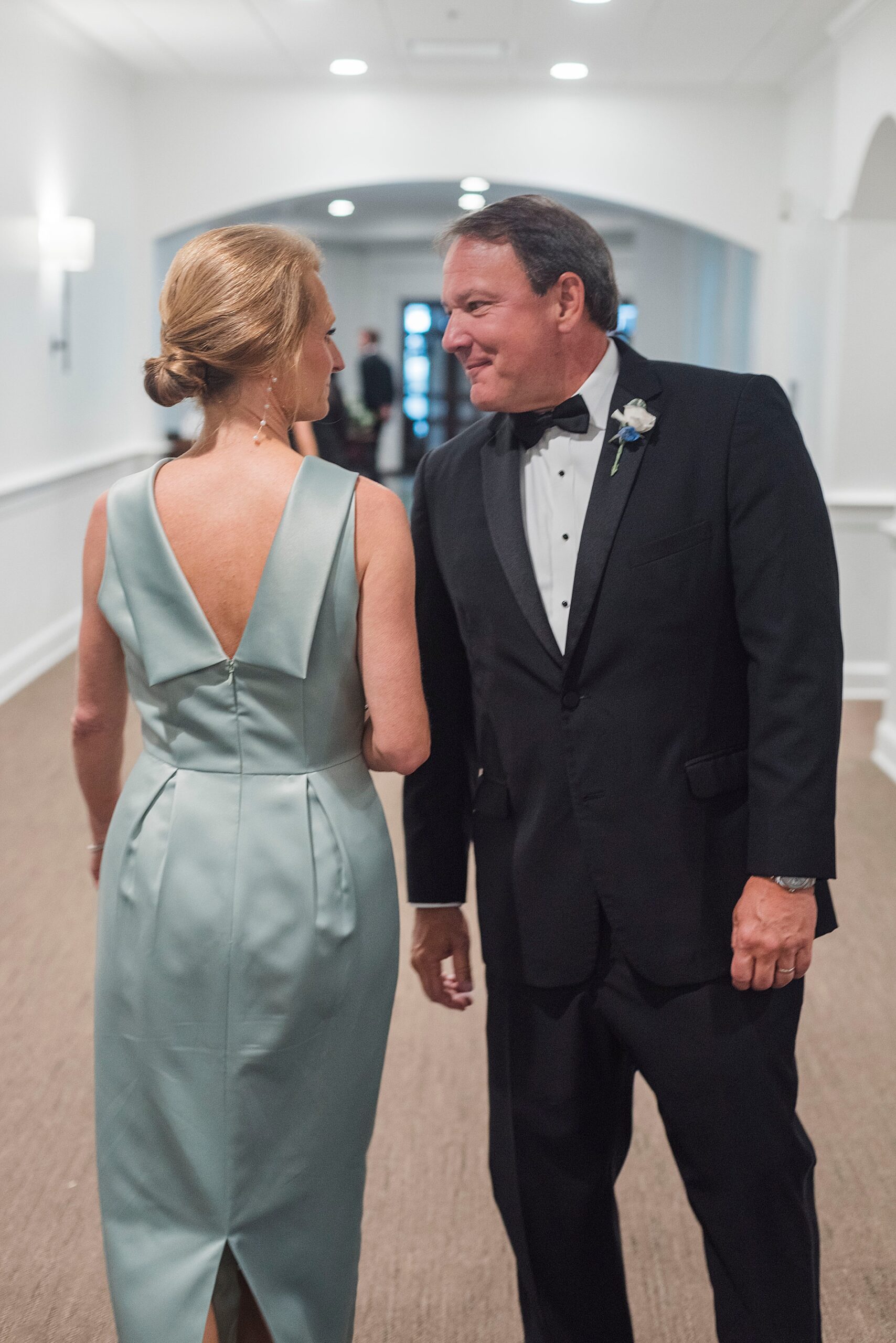 parents of the bride meet in hallway