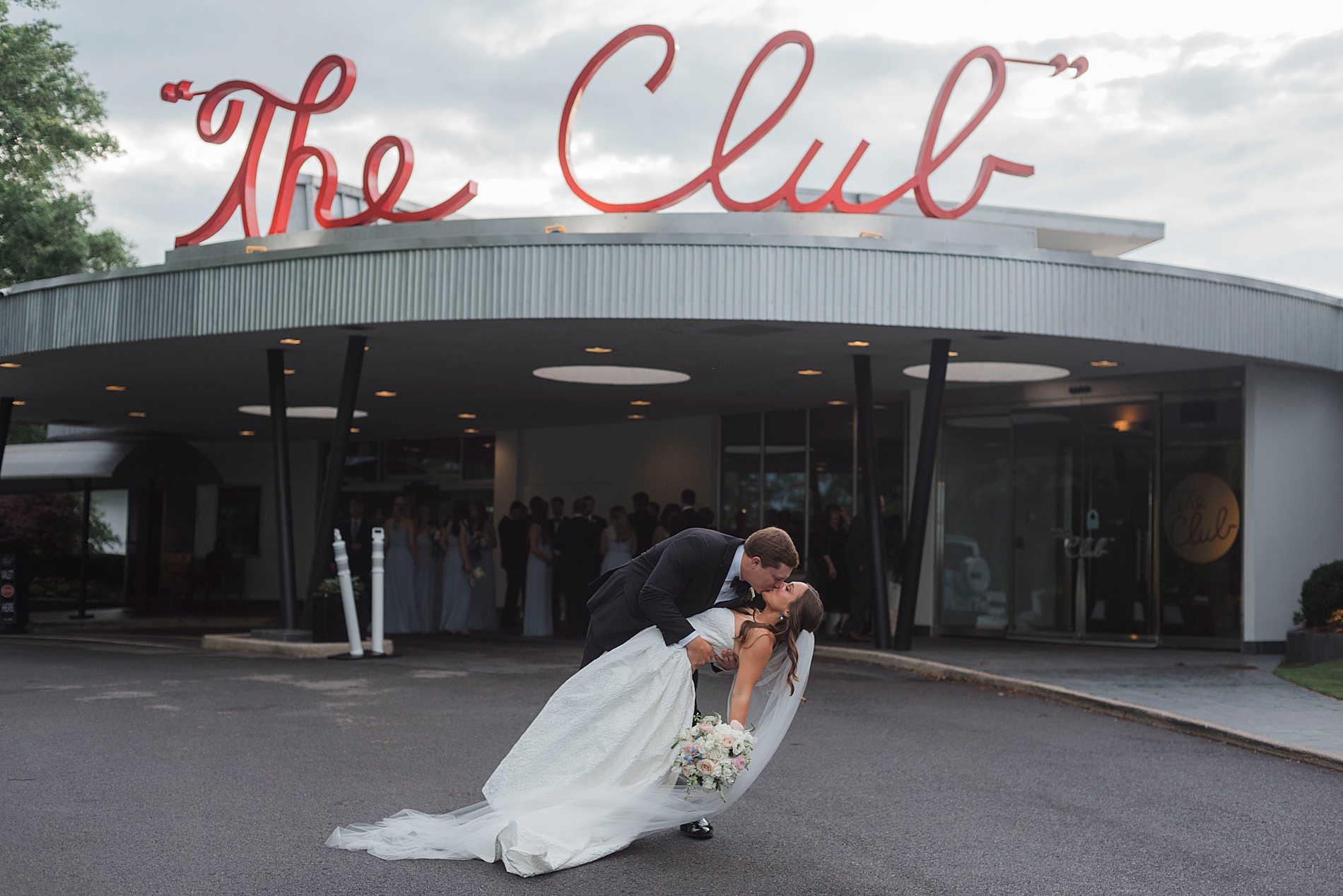 newlyweds kiss outside of Birmingham venue, The Club