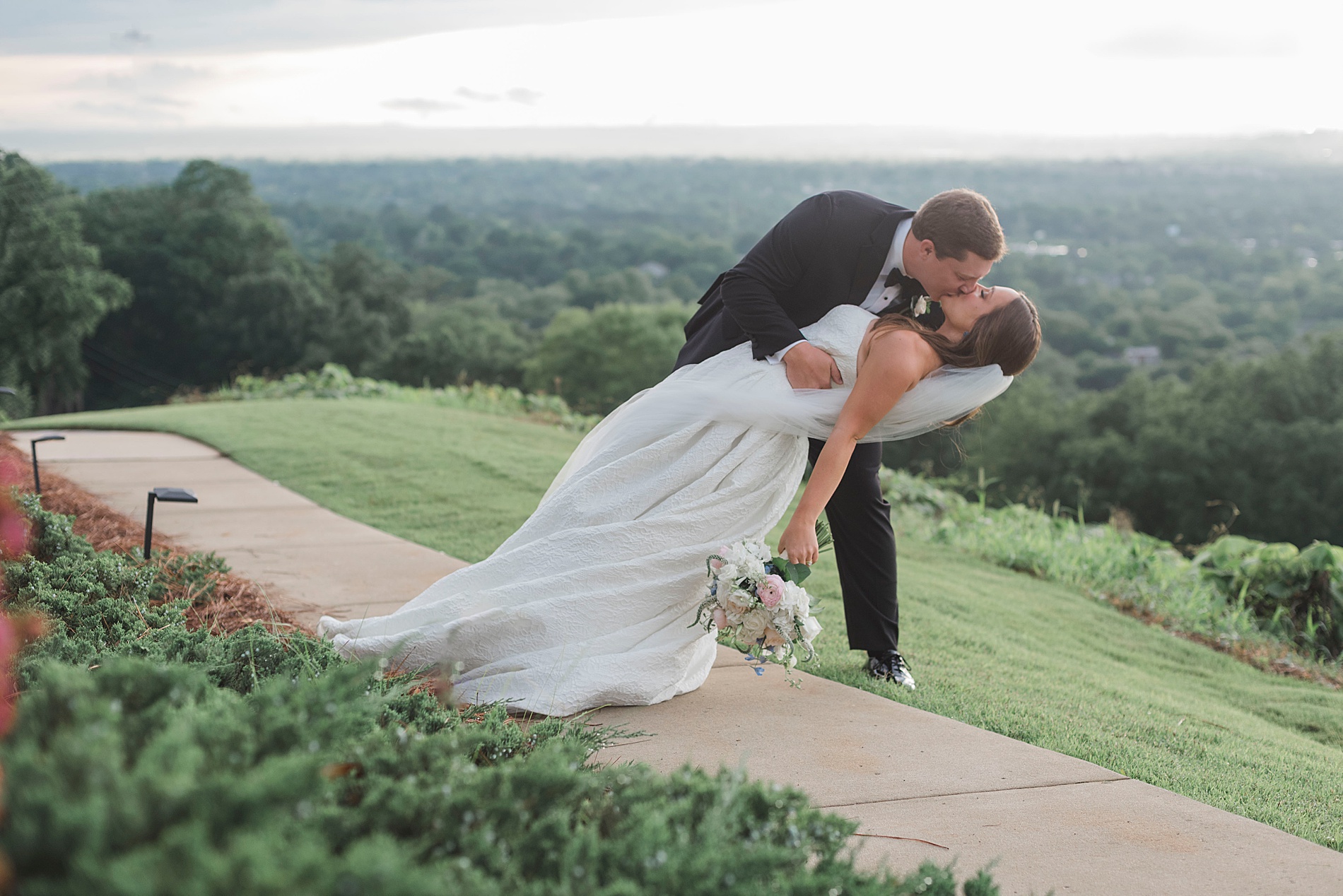 groom kisses bride during Memorable Birmingham Wedding