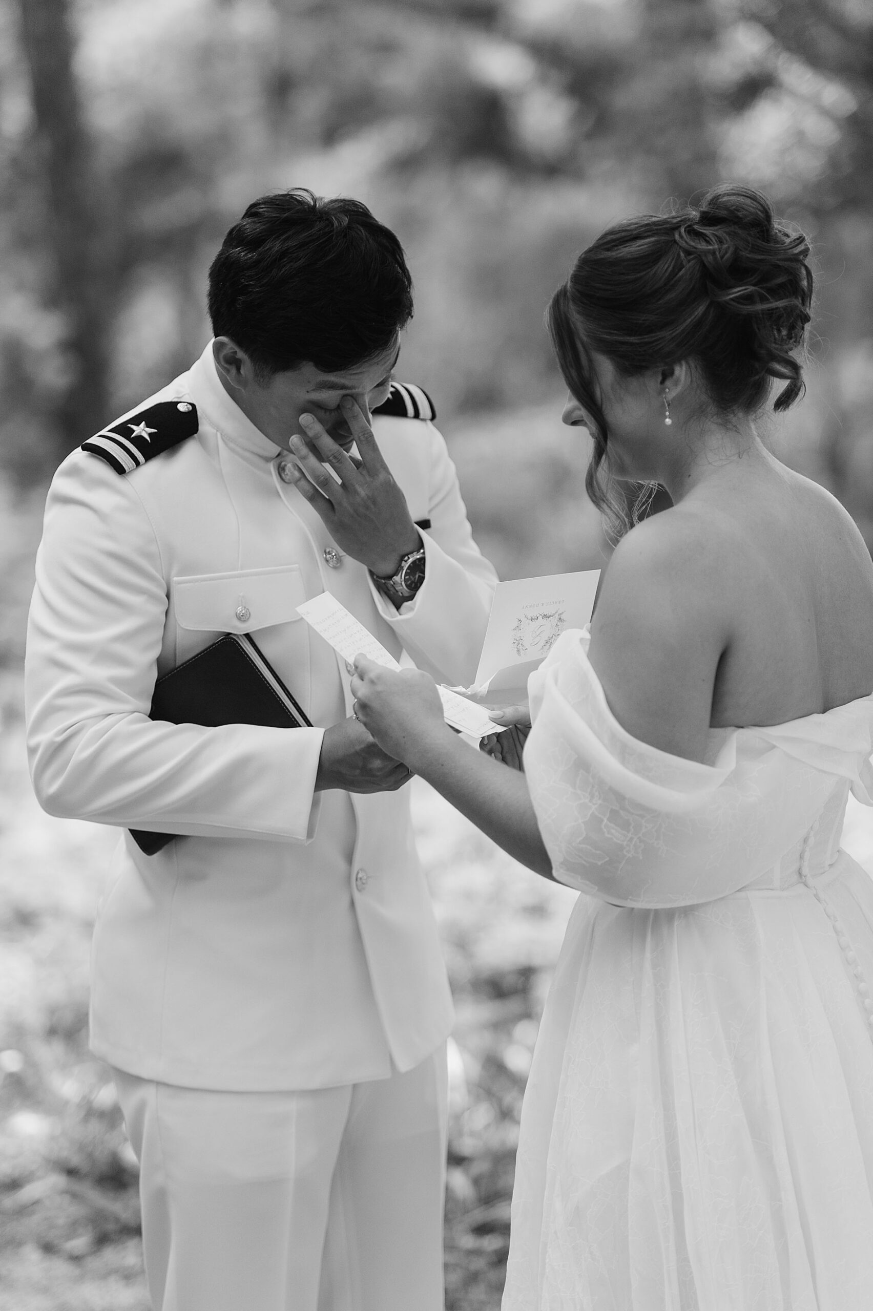 intimate moment during private vow exchange as groom wipes away tears