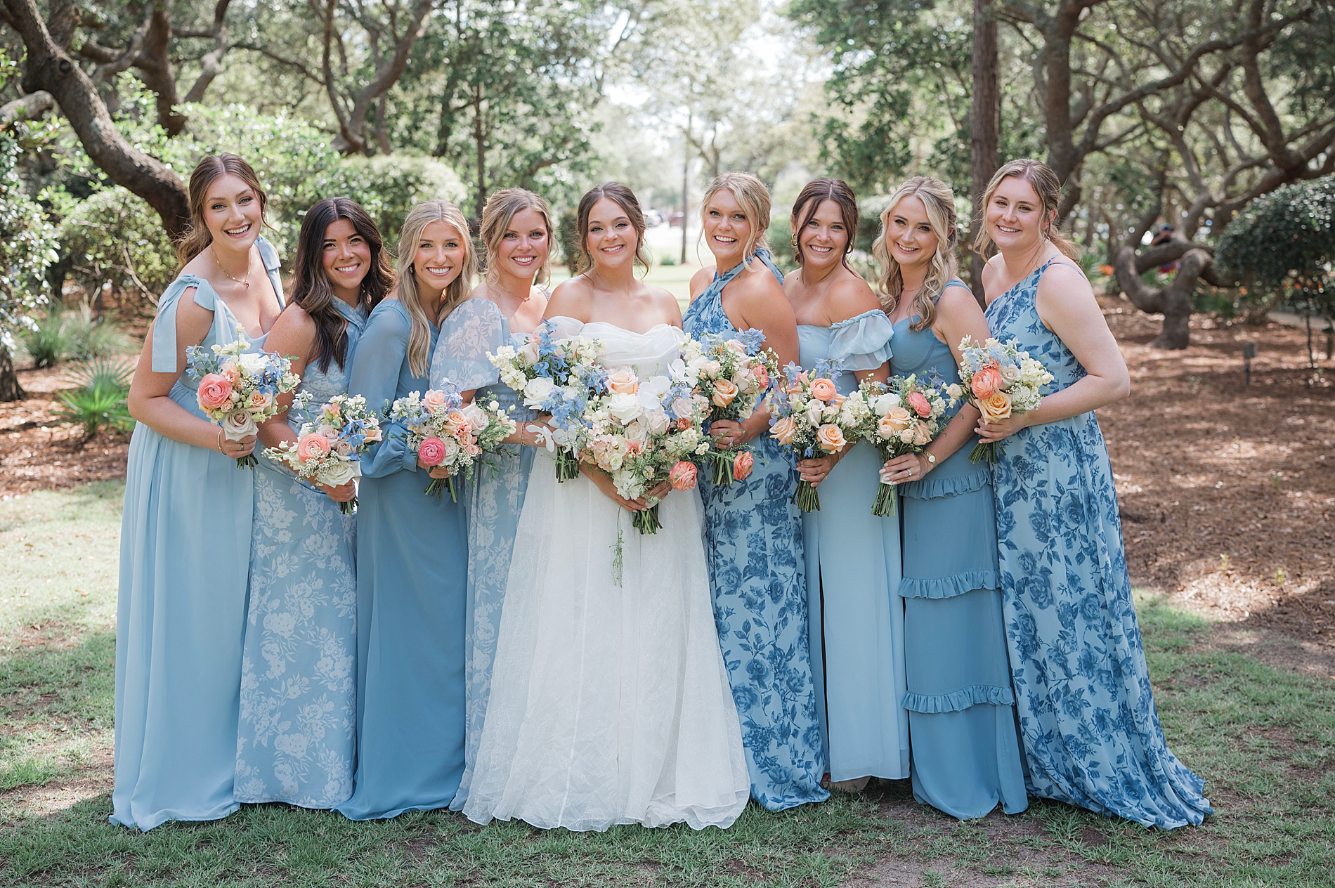 bridesmaids in different style and color blue dresses