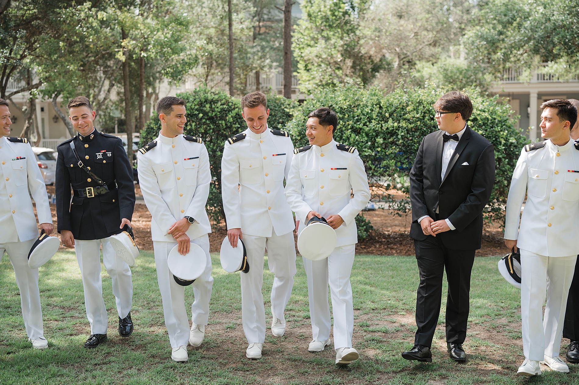 groomsmen walk with groom