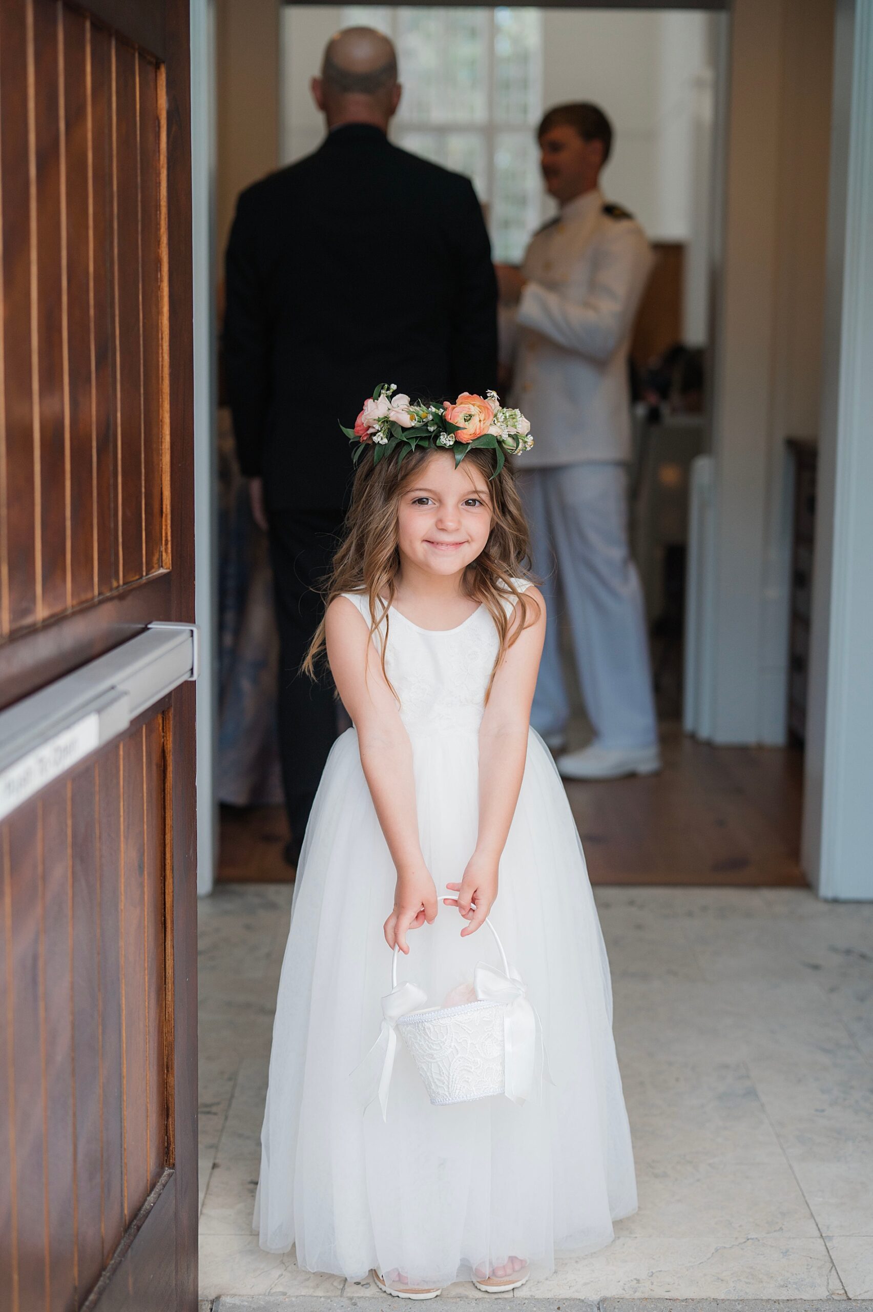flower girl getting ready to walk down the aisle