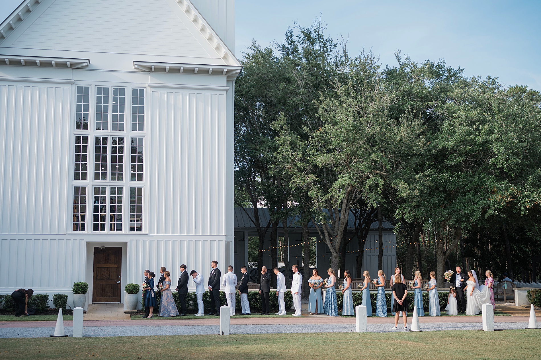 wedding party lined up outside of church