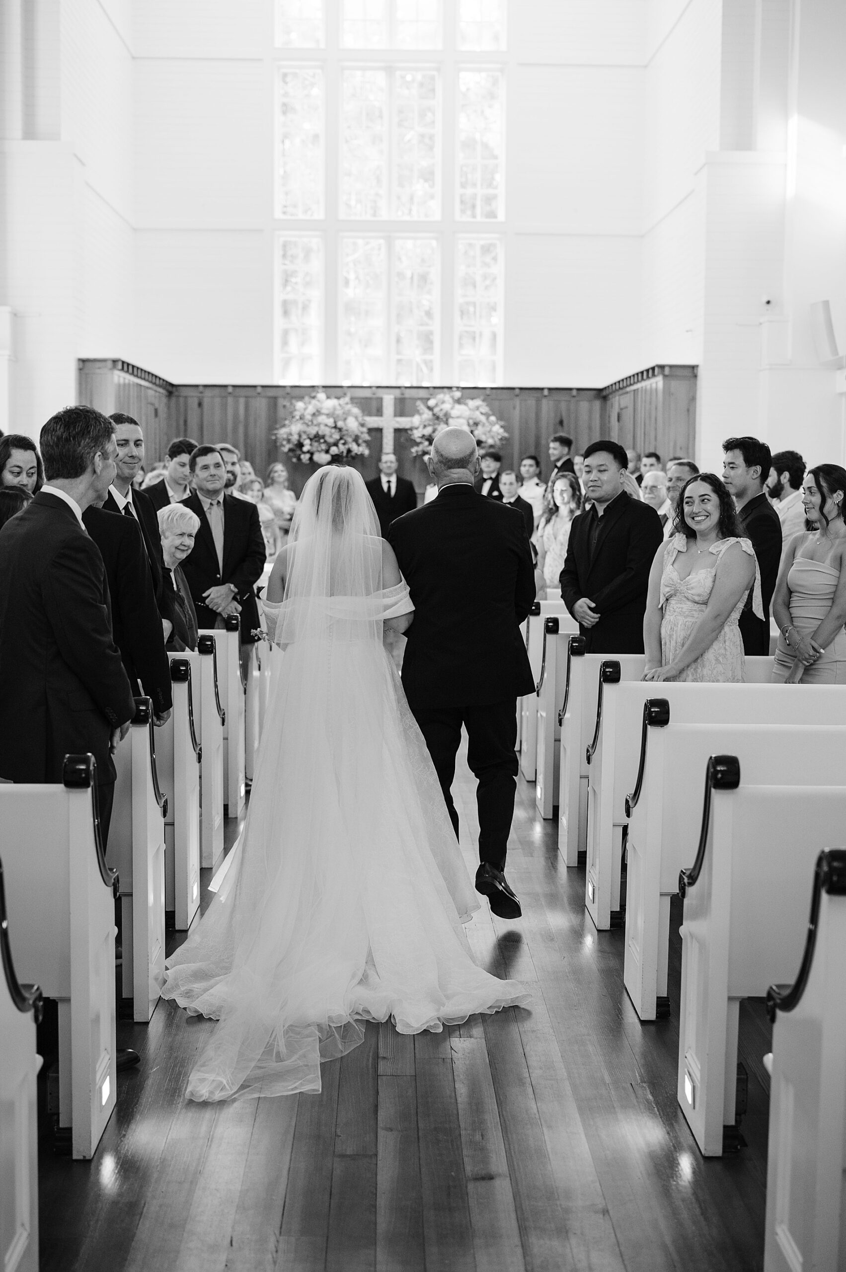 father walking bride down the aisle of wedding