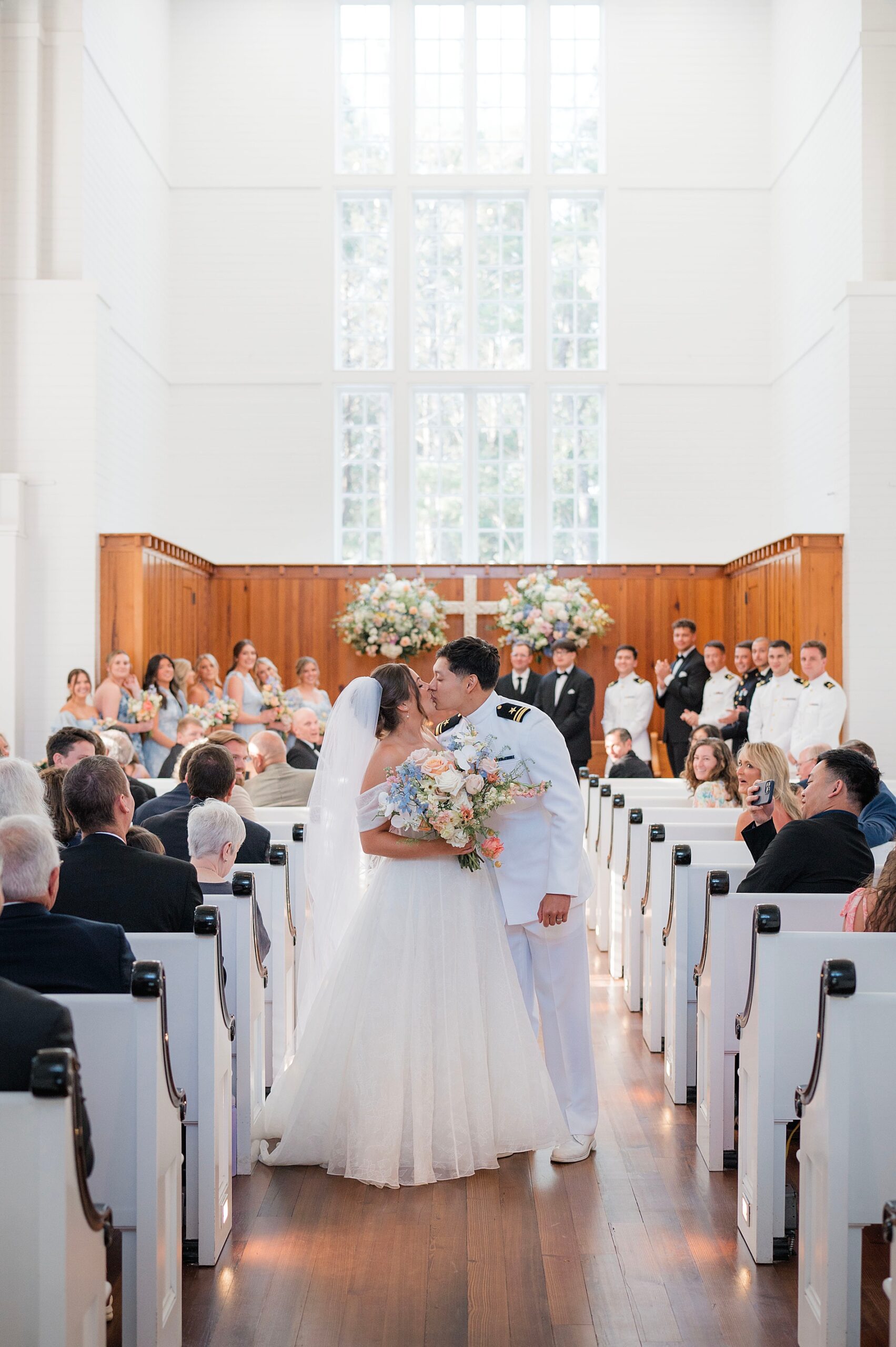 newlyweds exit church as they kiss