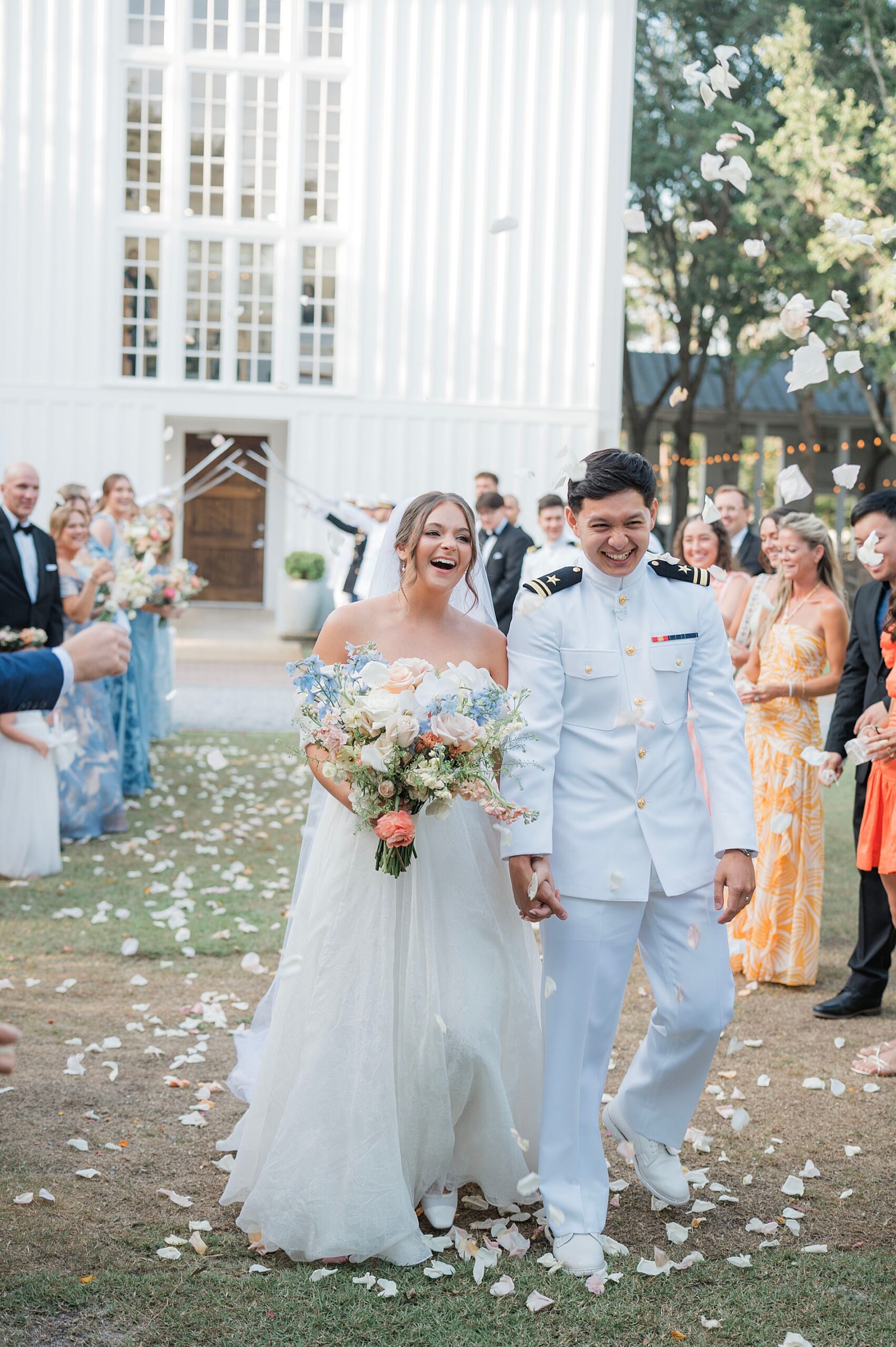 newlyweds exit church as guests throw flower petals