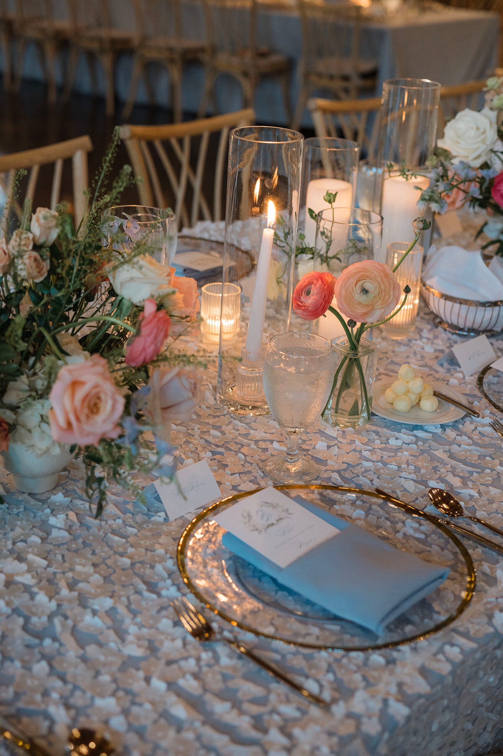 wedding menus tucked in dusty blue napkins