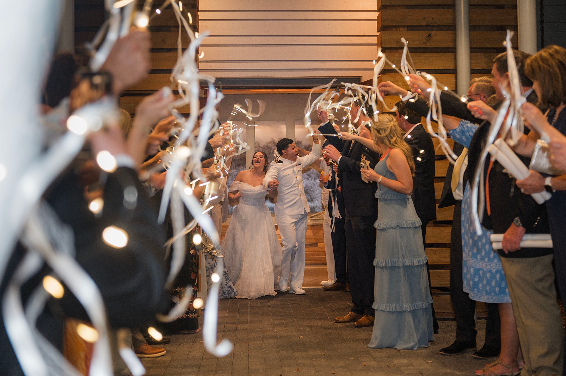 wedding guests send off newlyweds