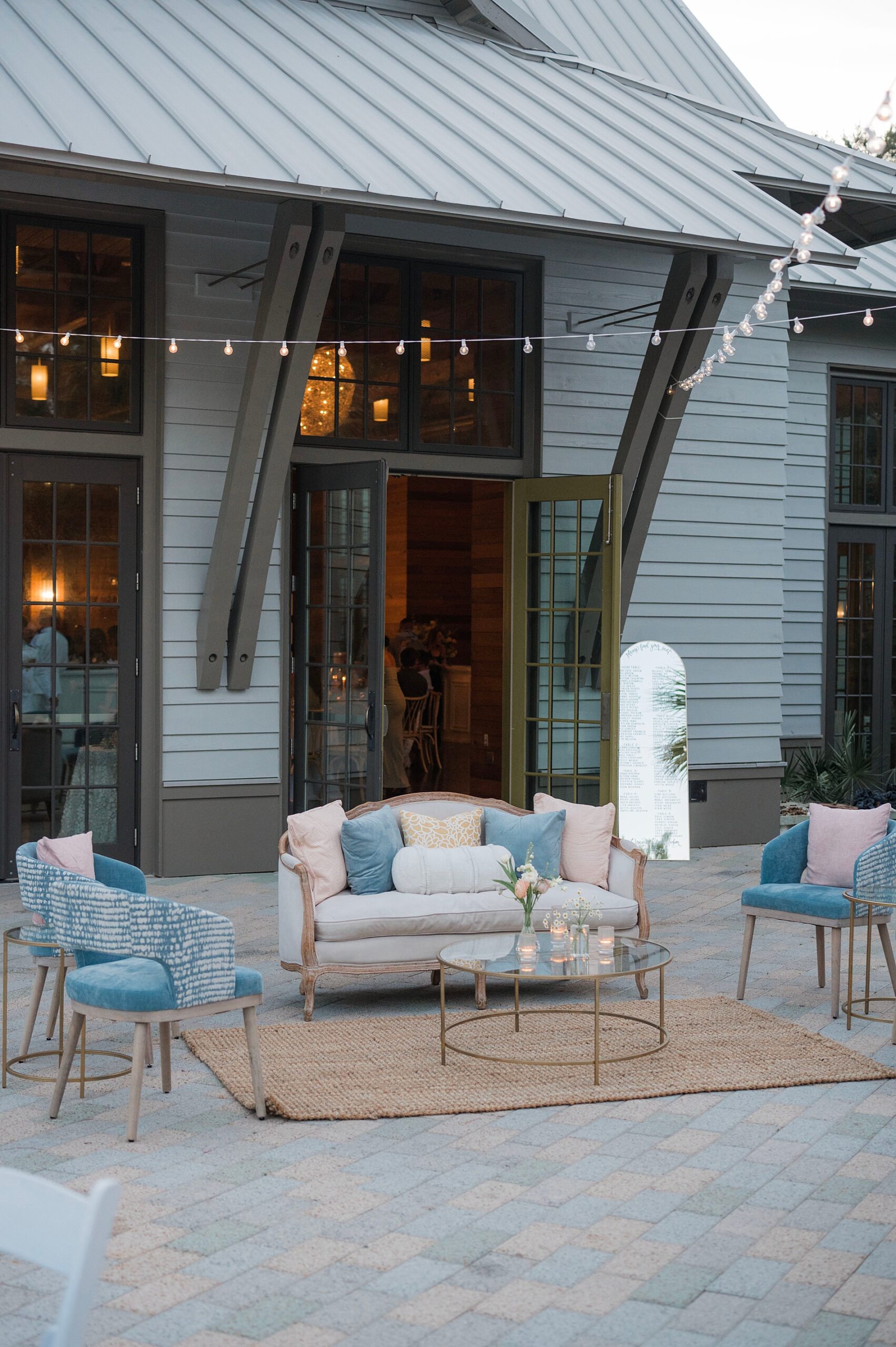 outdoor seating and stringed lights over patio for cocktail hour