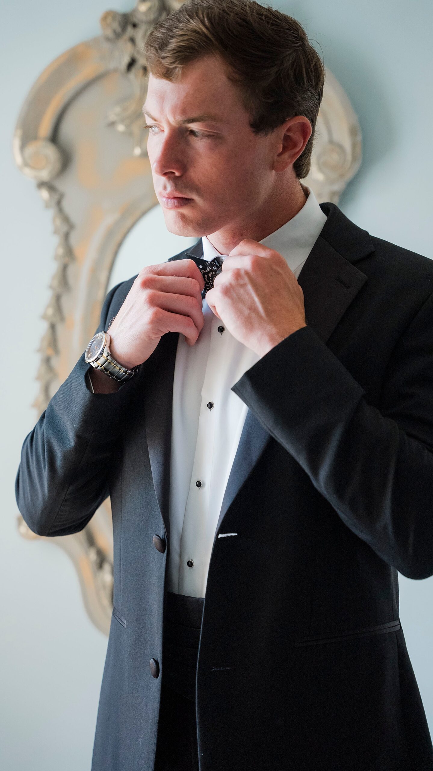 groom straightens bowtie