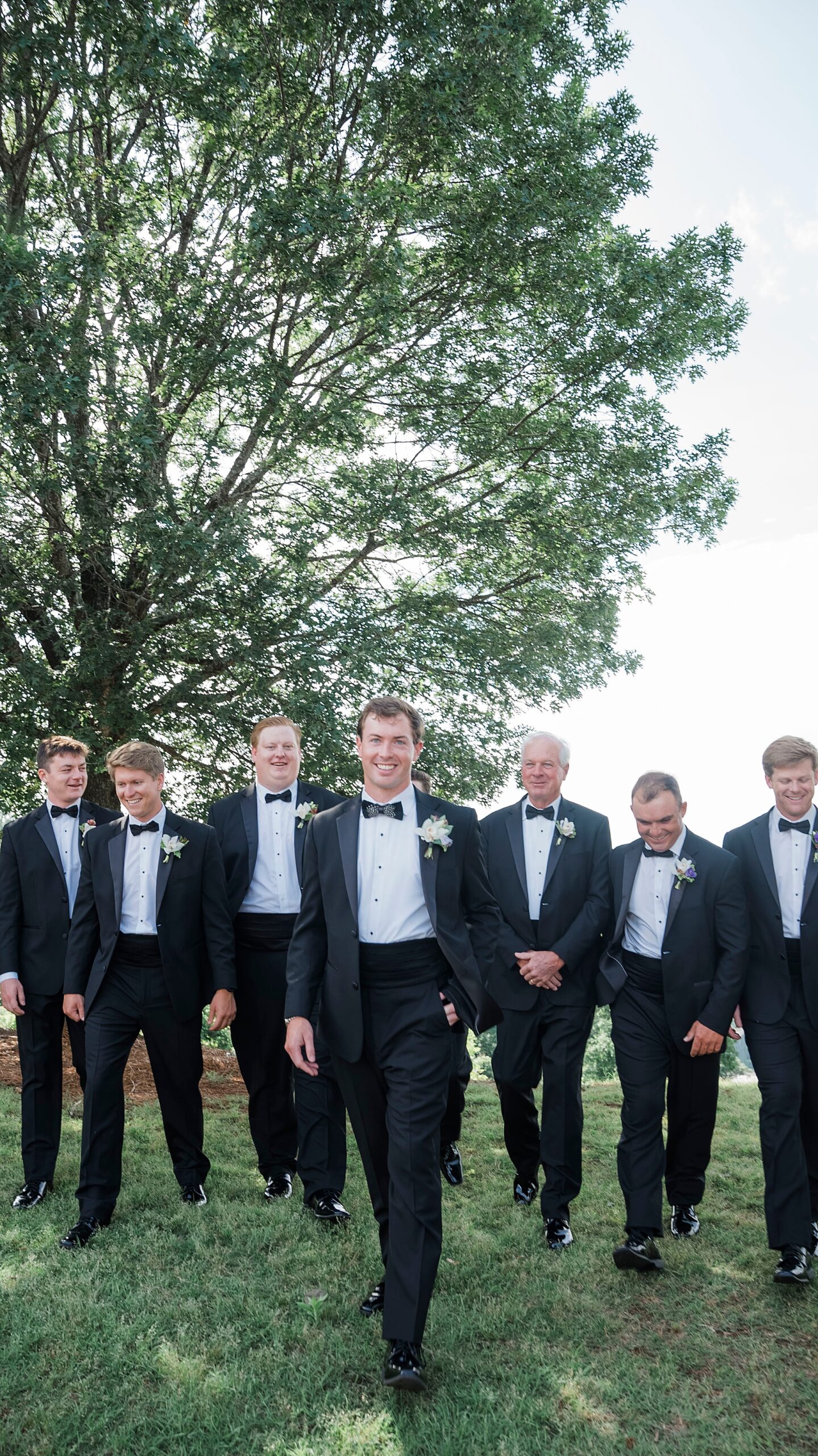 groom and groomsmen walk together