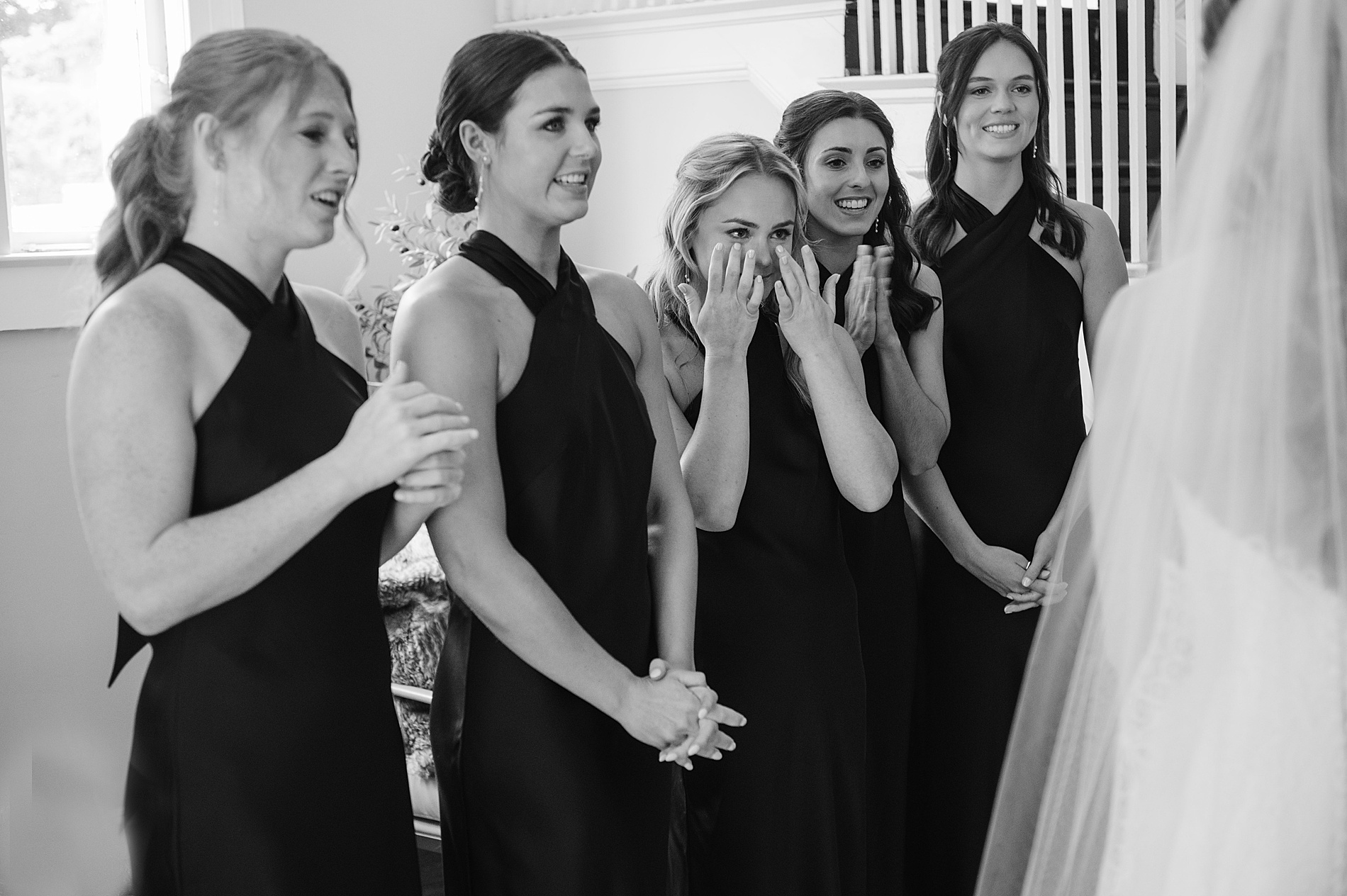 bridesmaids get emotional during first look with bride