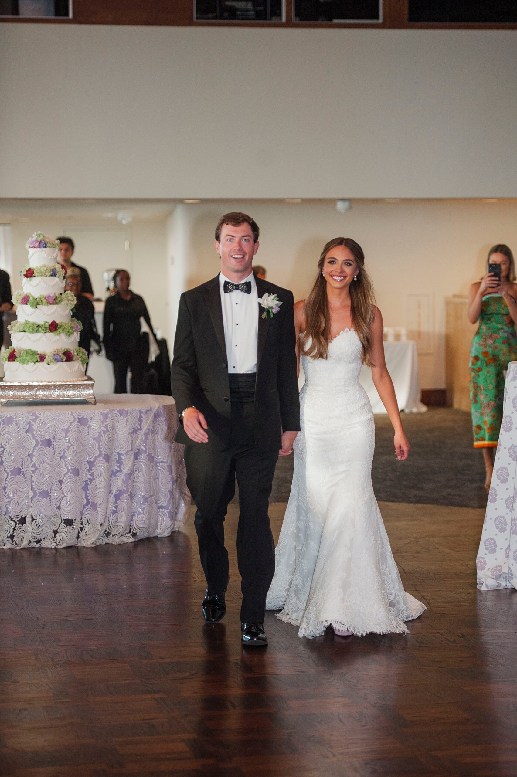 newlyweds enter wedding reception