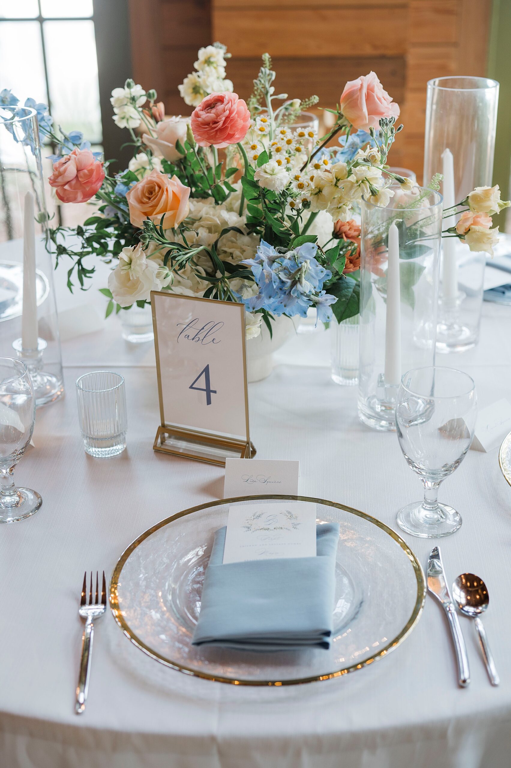 soft floral centerpieces and place setting at elegant wedding in Florida 