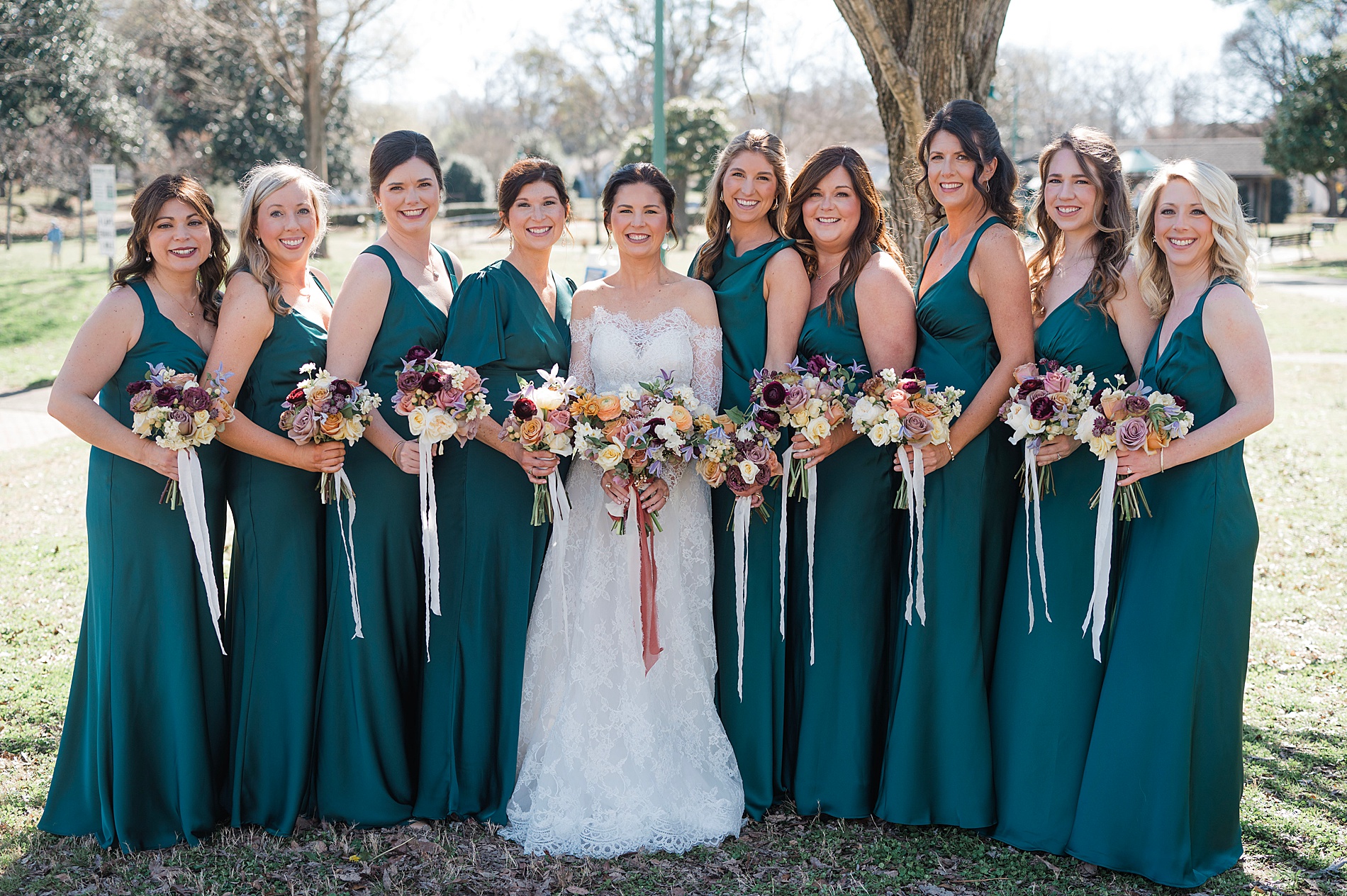 bride with bridesmaids in teal bridesmaids dresses