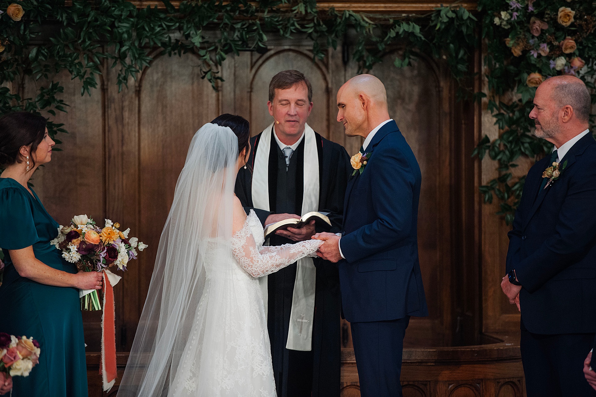 bride and groom exchange vows at wedding ceremony