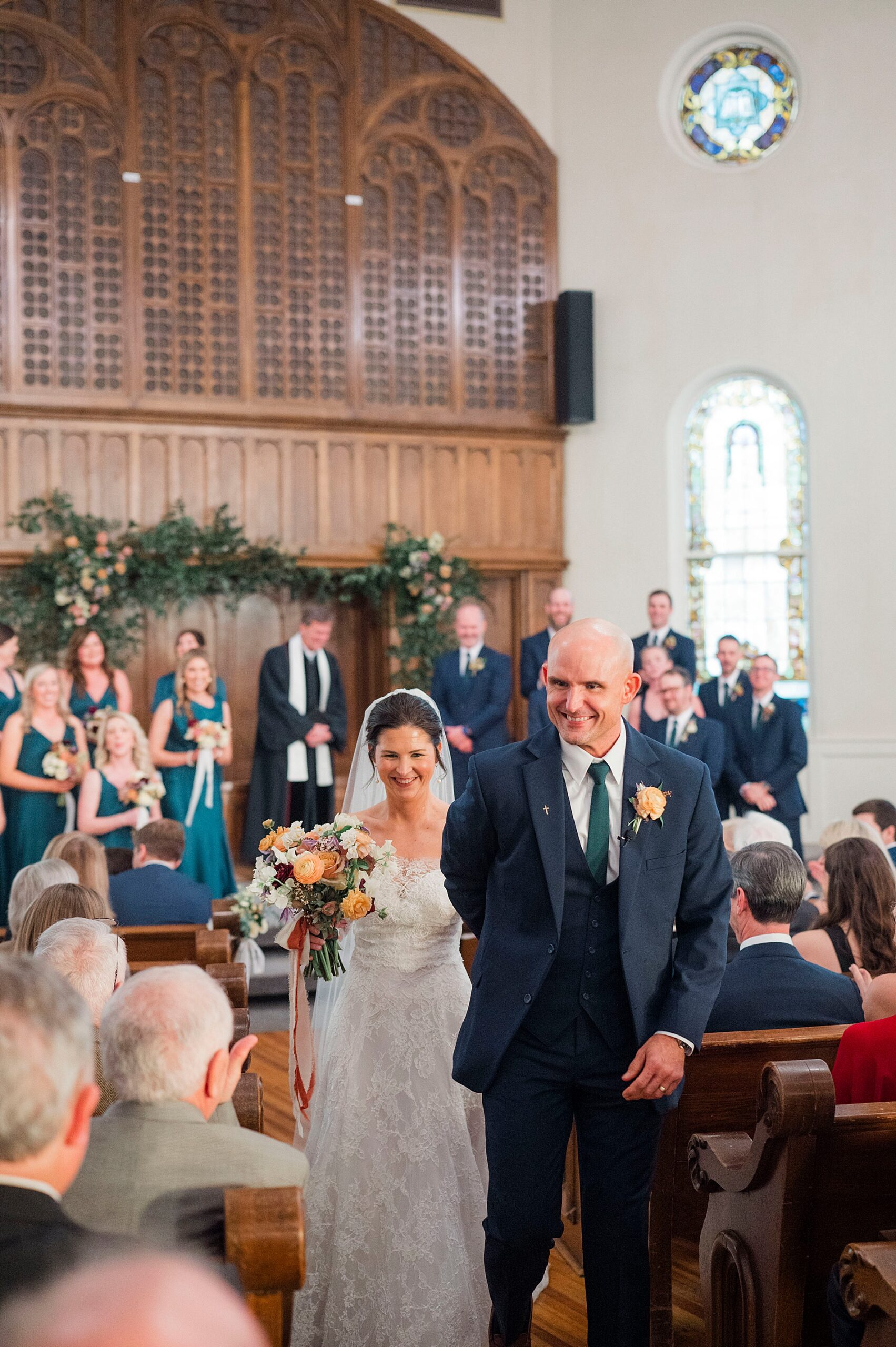 newlyweds exit wedding ceremony as husband and wife