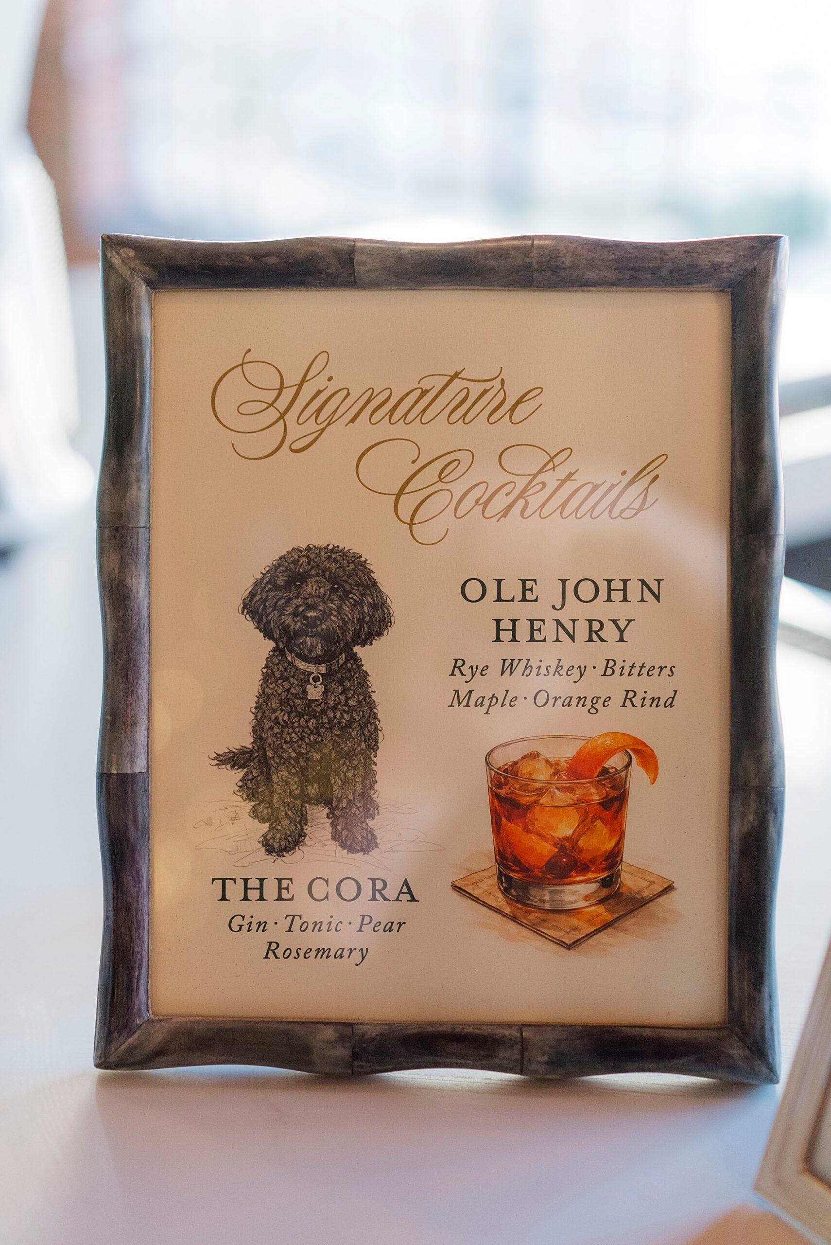 signature cocktail sign featuring picture of couples dog