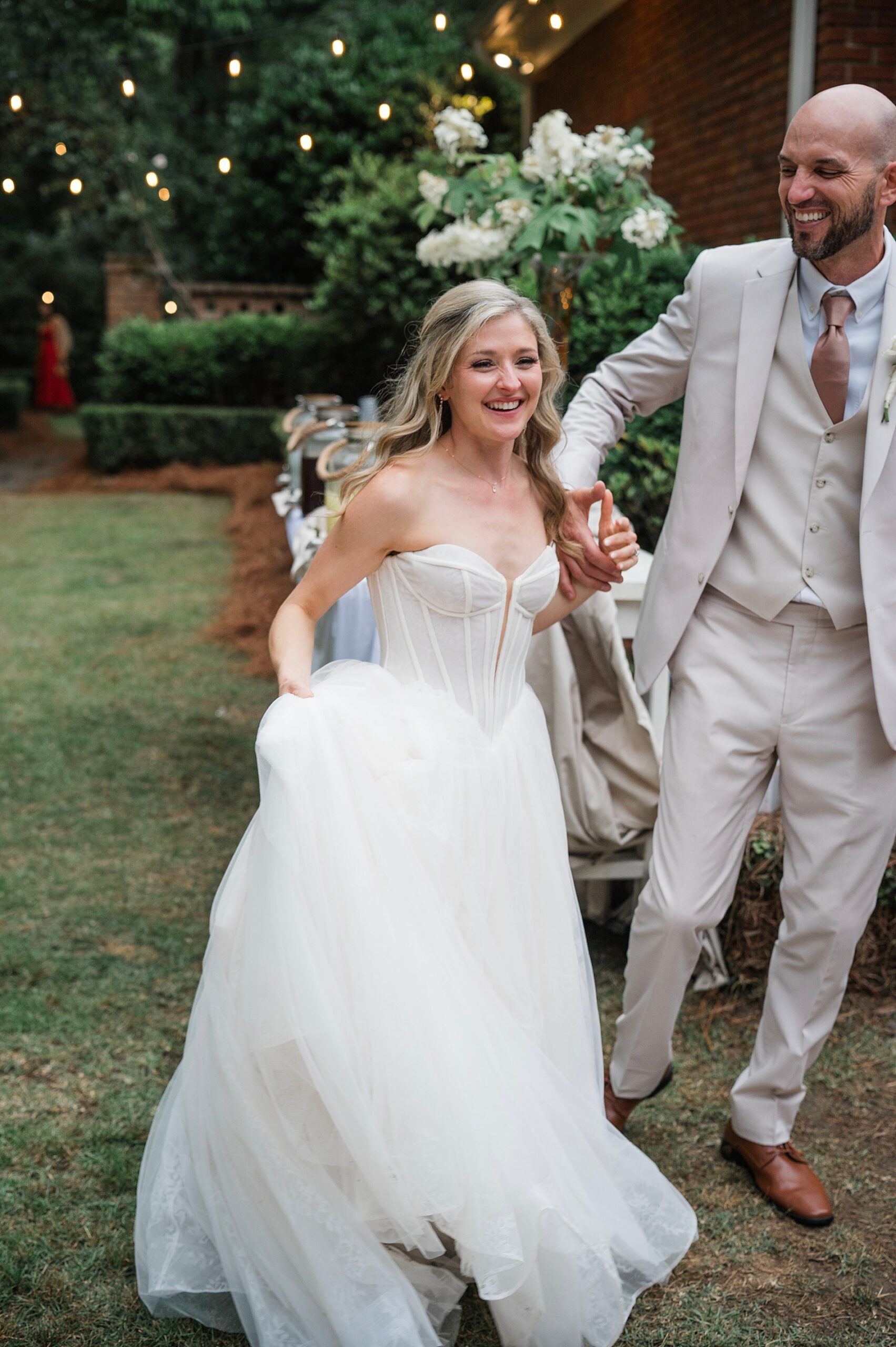 newlyweds walking into reception area 