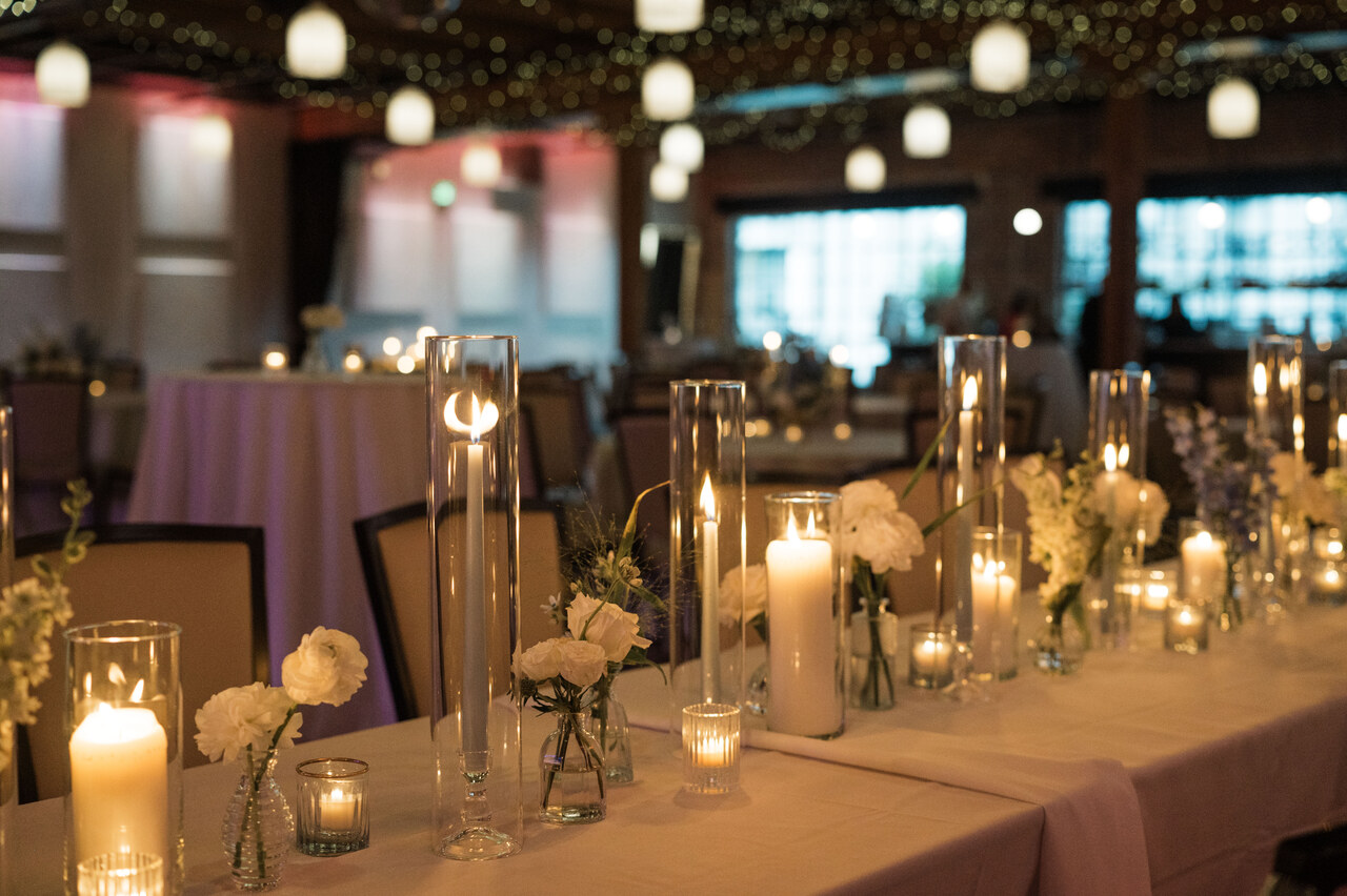 flickering candlelight along center of table