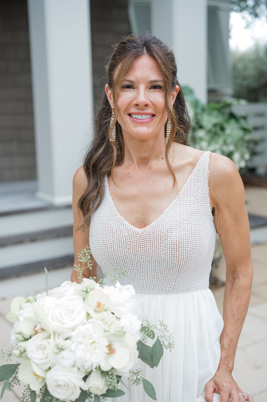 bridal portraits in wedding dress with white rose bouquet