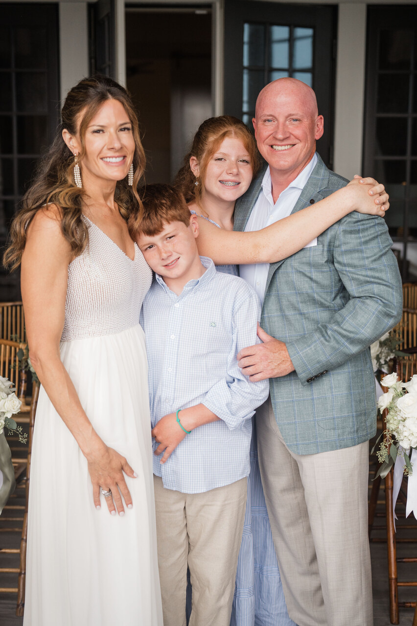 couple with their kids on wedding day from 30A beach wedding weekend 