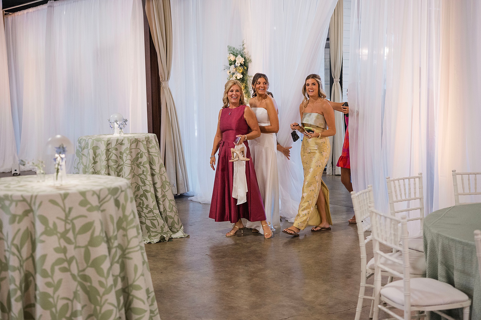 wedding guests enter party space 