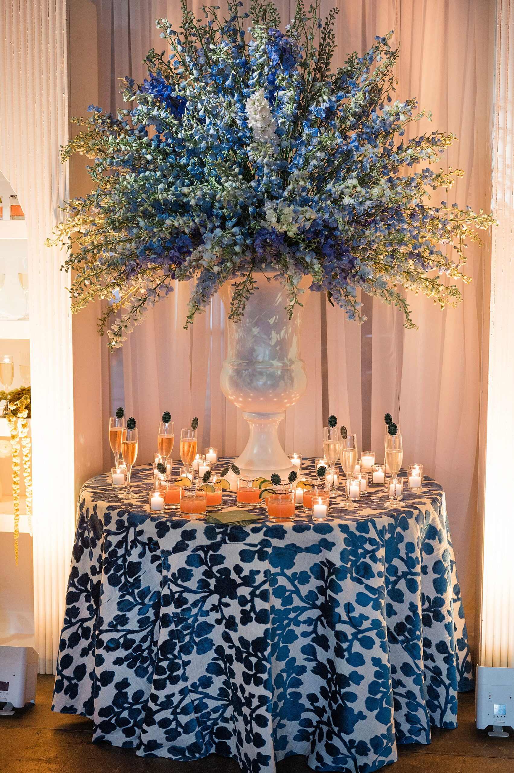 blue floral display on table with drinks